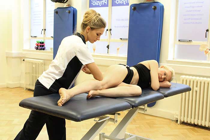 Customer receiving a calf massage while in a relaxed position