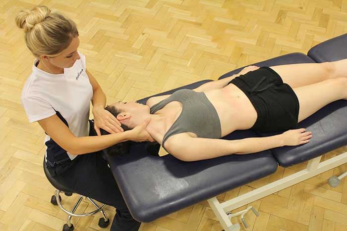 Customer receiving a neck massage while in a relaxed position