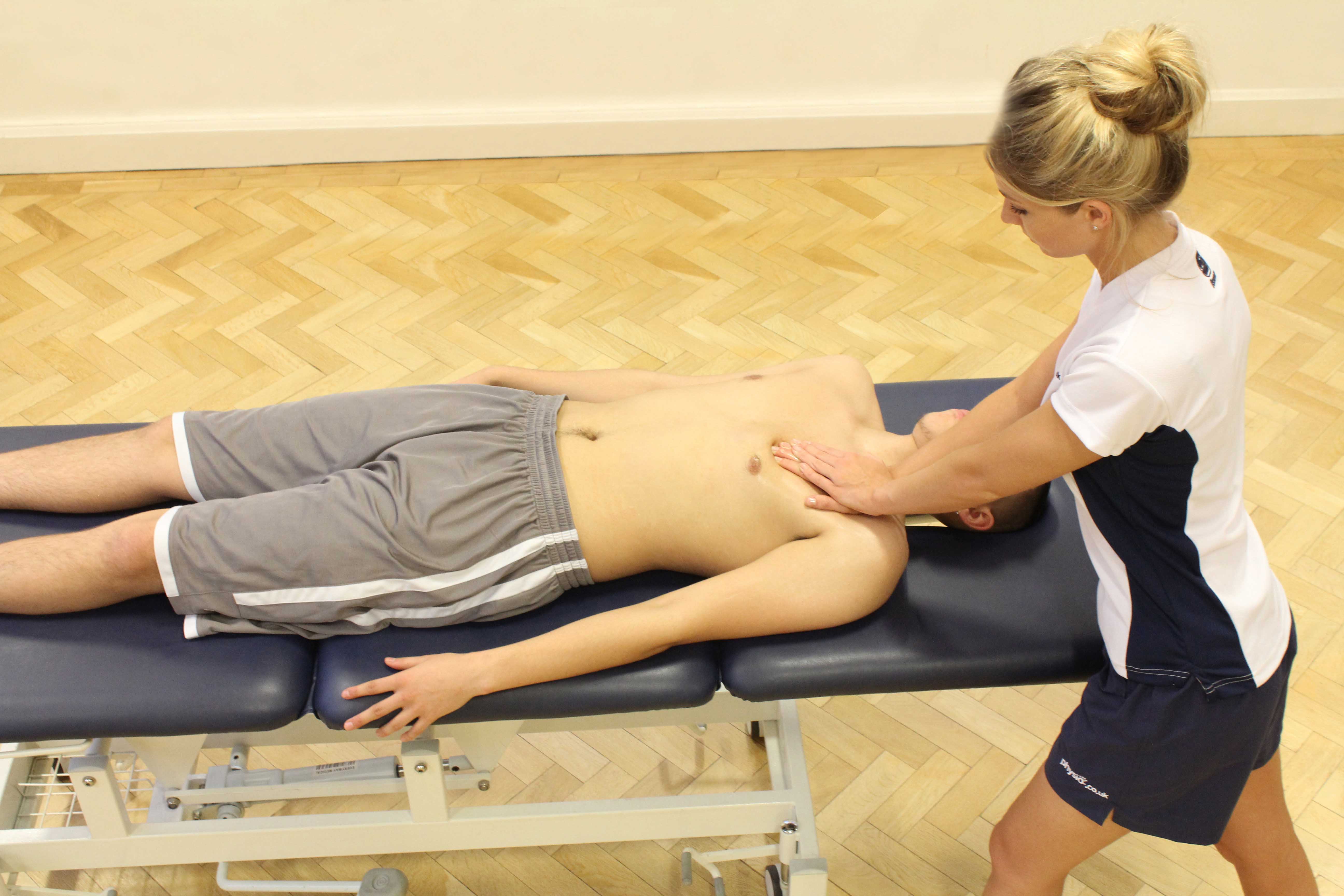 Soft tissue massage of the chest muscle and connective tissues by specialist MSK therapist Soft tissue massage of the chest muscle and connective tissues by specialist MSK therapist