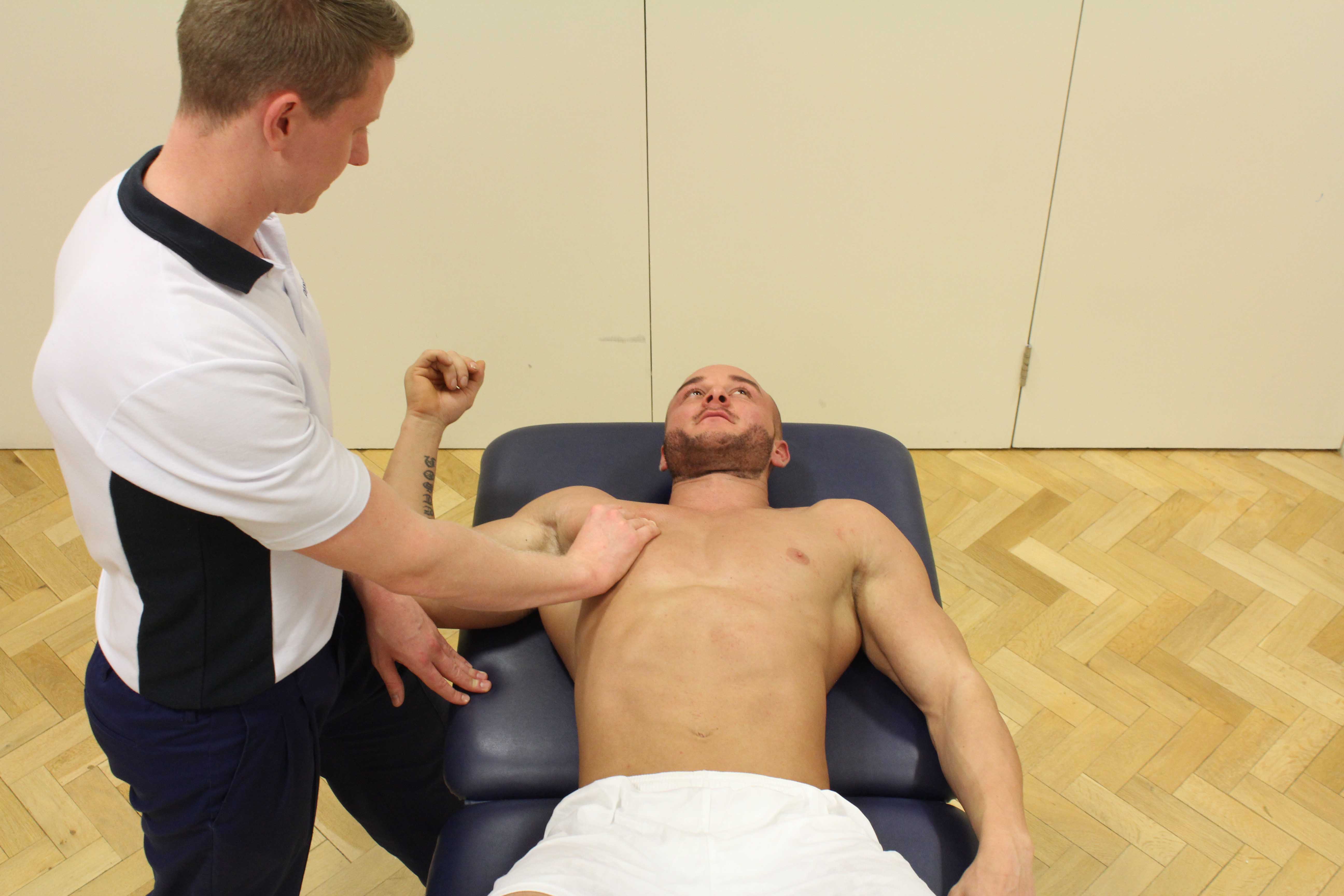 Trigger point massage of the chest muscle by MSK therapist