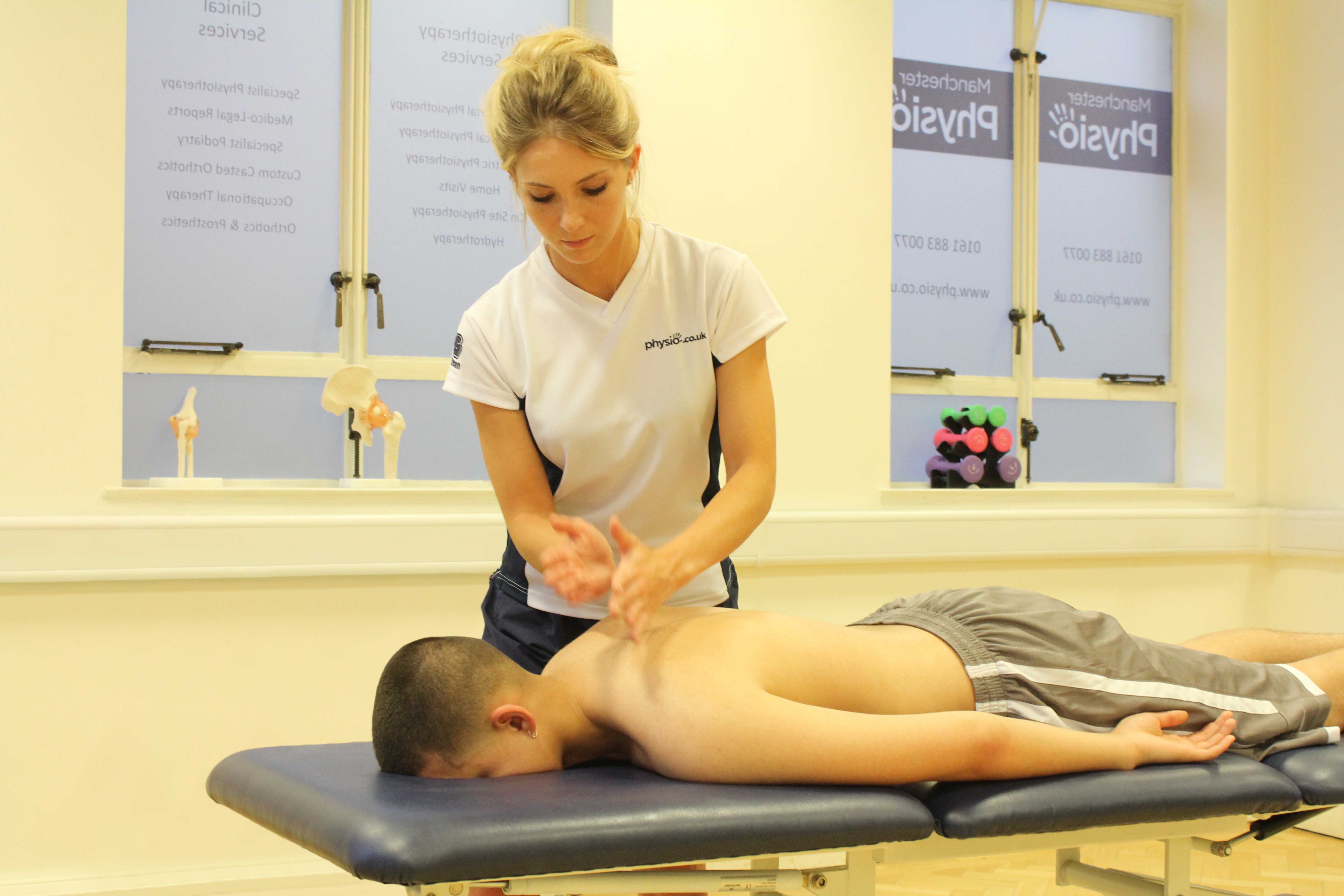 Hacking percussion massage technique applied to trapezius and latissimus dorsi muscle