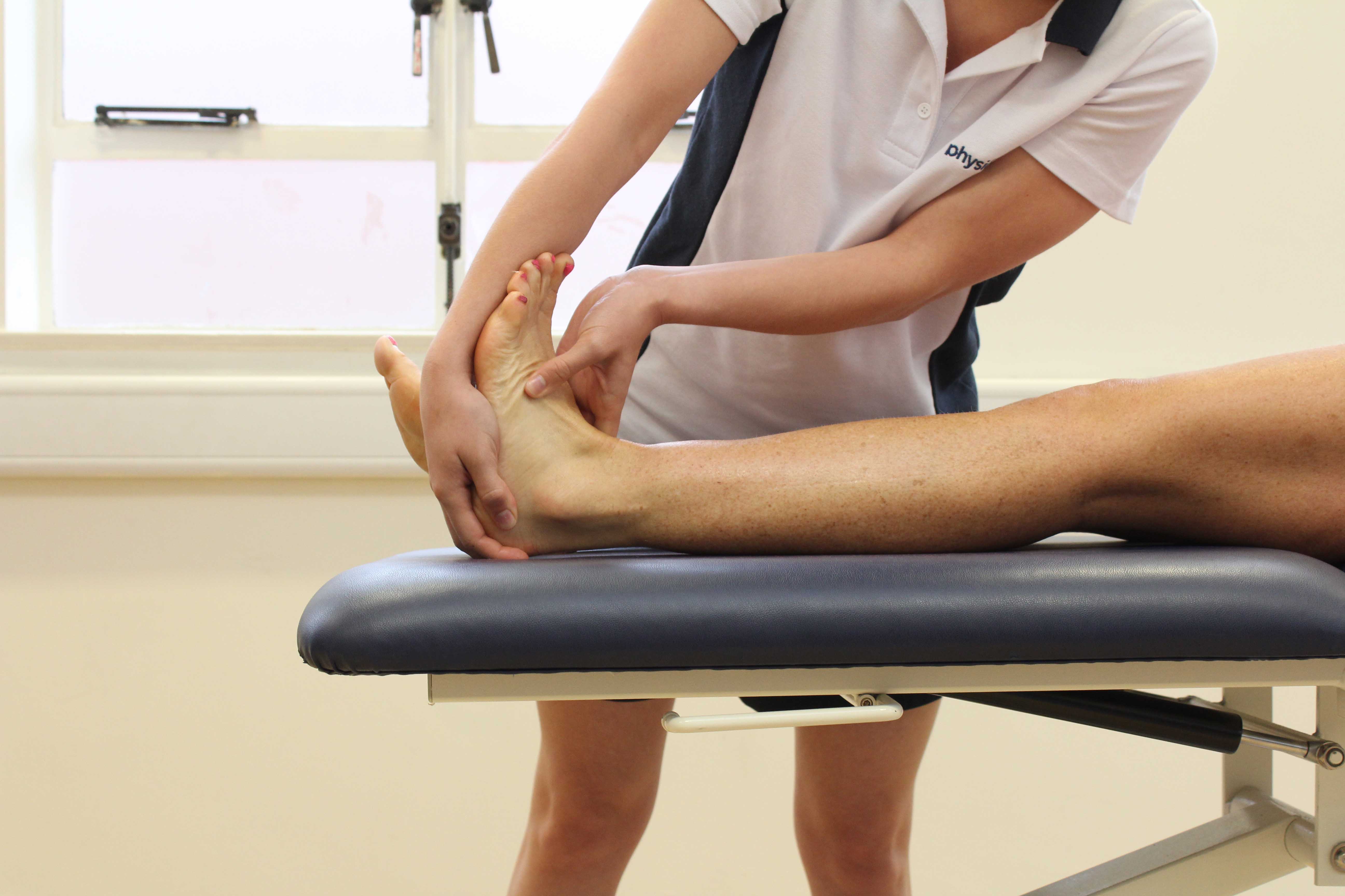 Passive stretch of the achilles tendon performed by specialist therapist