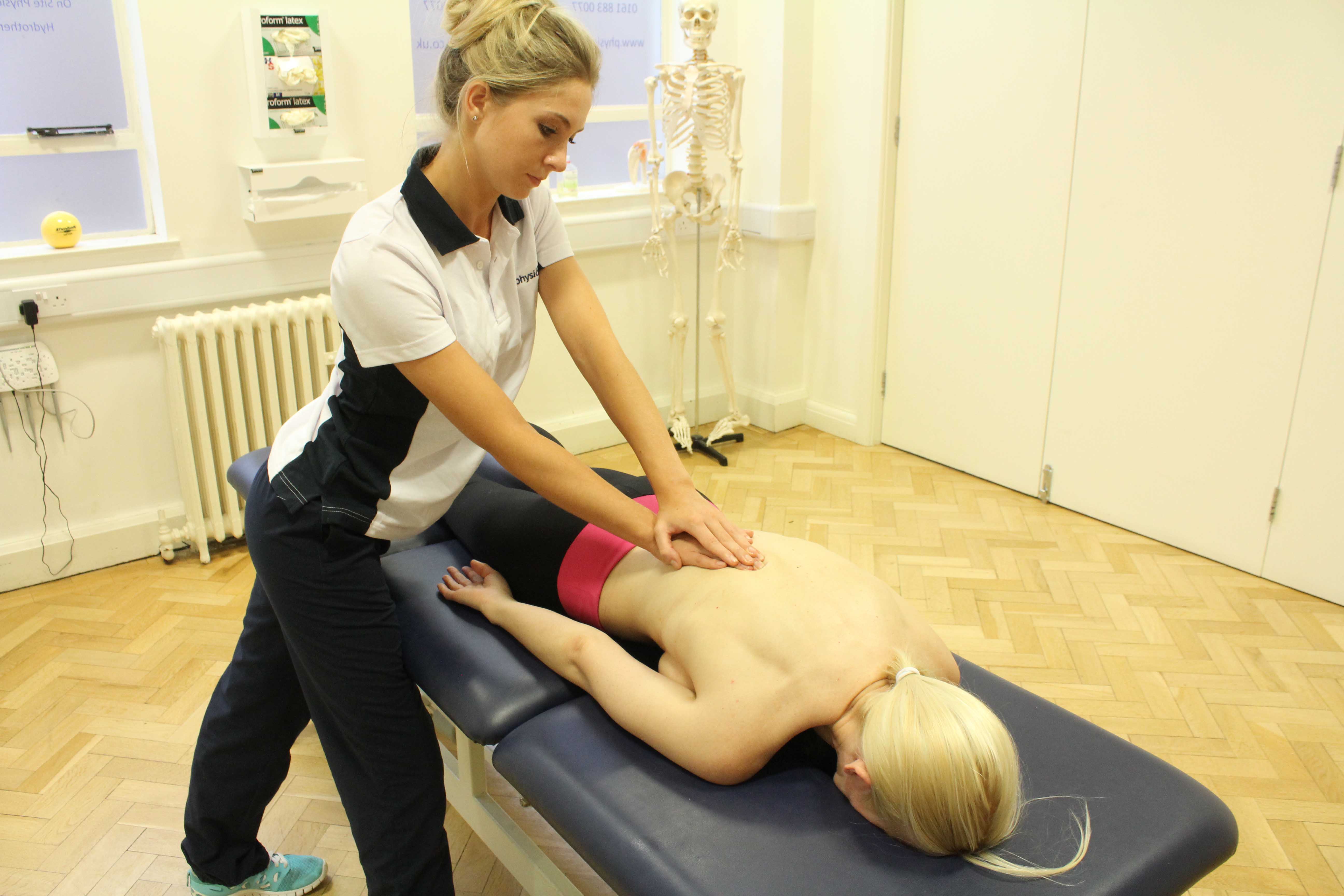 Soft tissue massage of the lower back muscles and connective tissue by specialist therapist Soft tissue massage of the lower back muscles and connective tissue by specialist therapist
