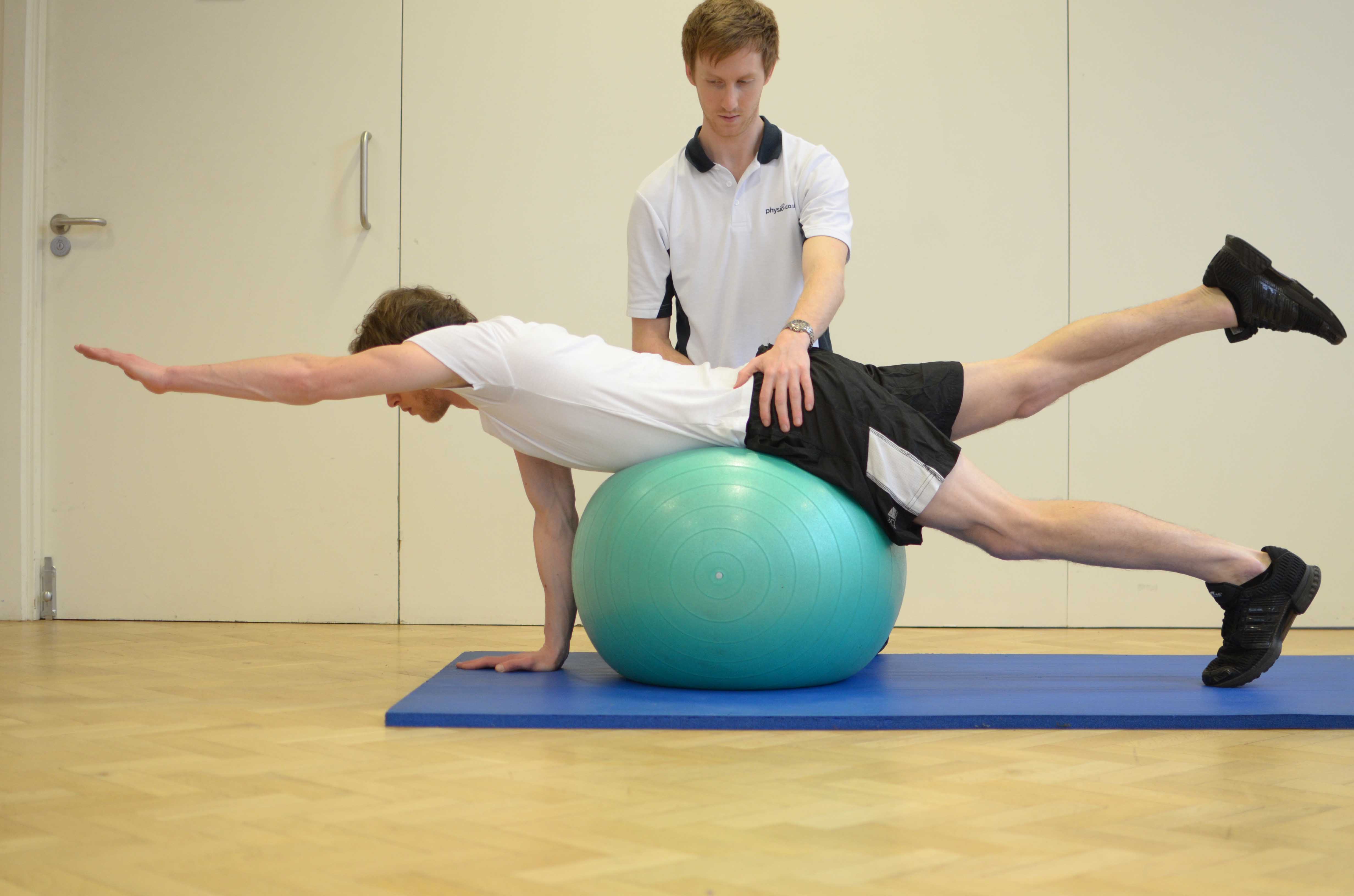 Progressive strengthening exercises for the lower back supervised by specialist MSK physiotherapist