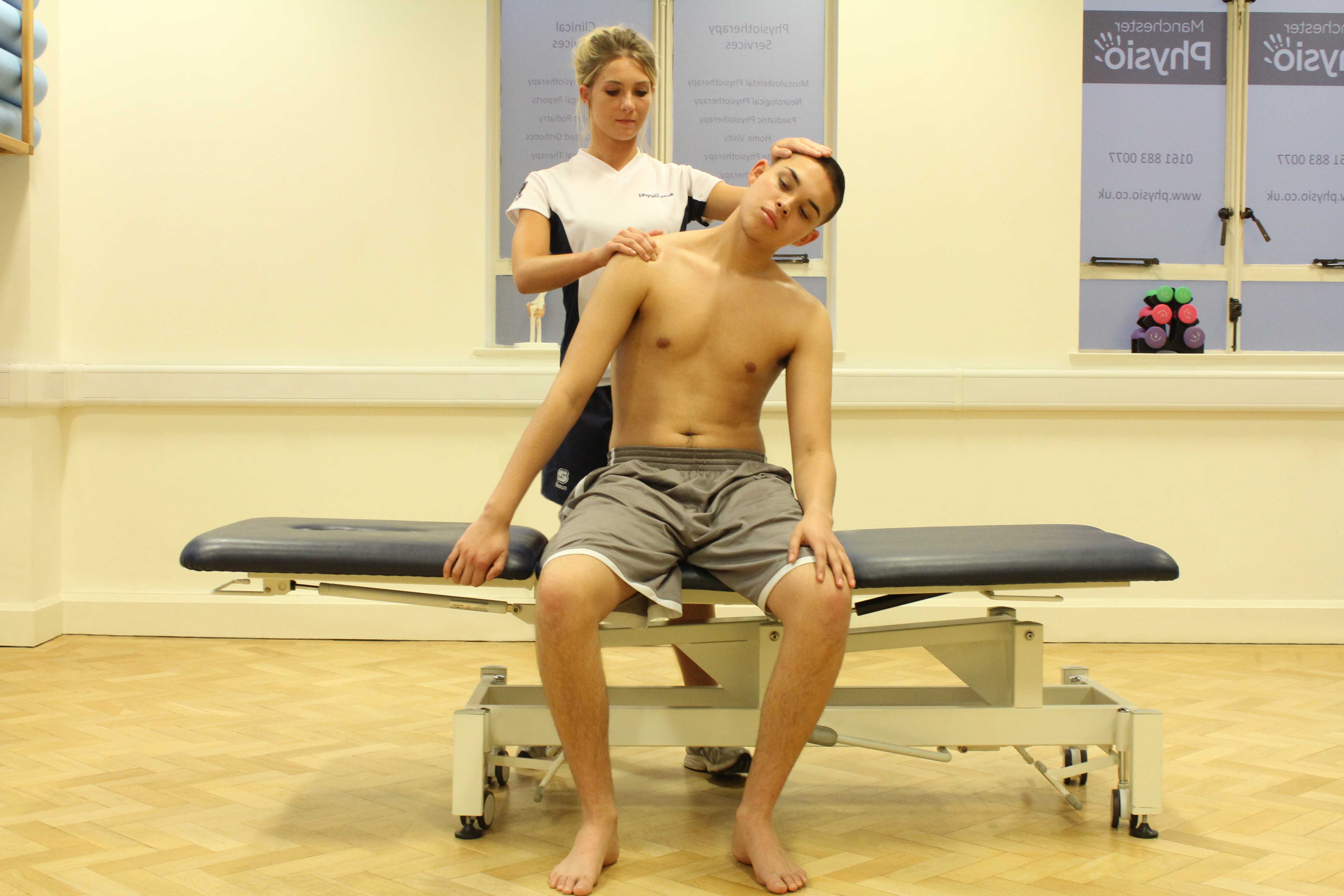 Passive stretch of the trapezius muscle in the neck by experienced therapist