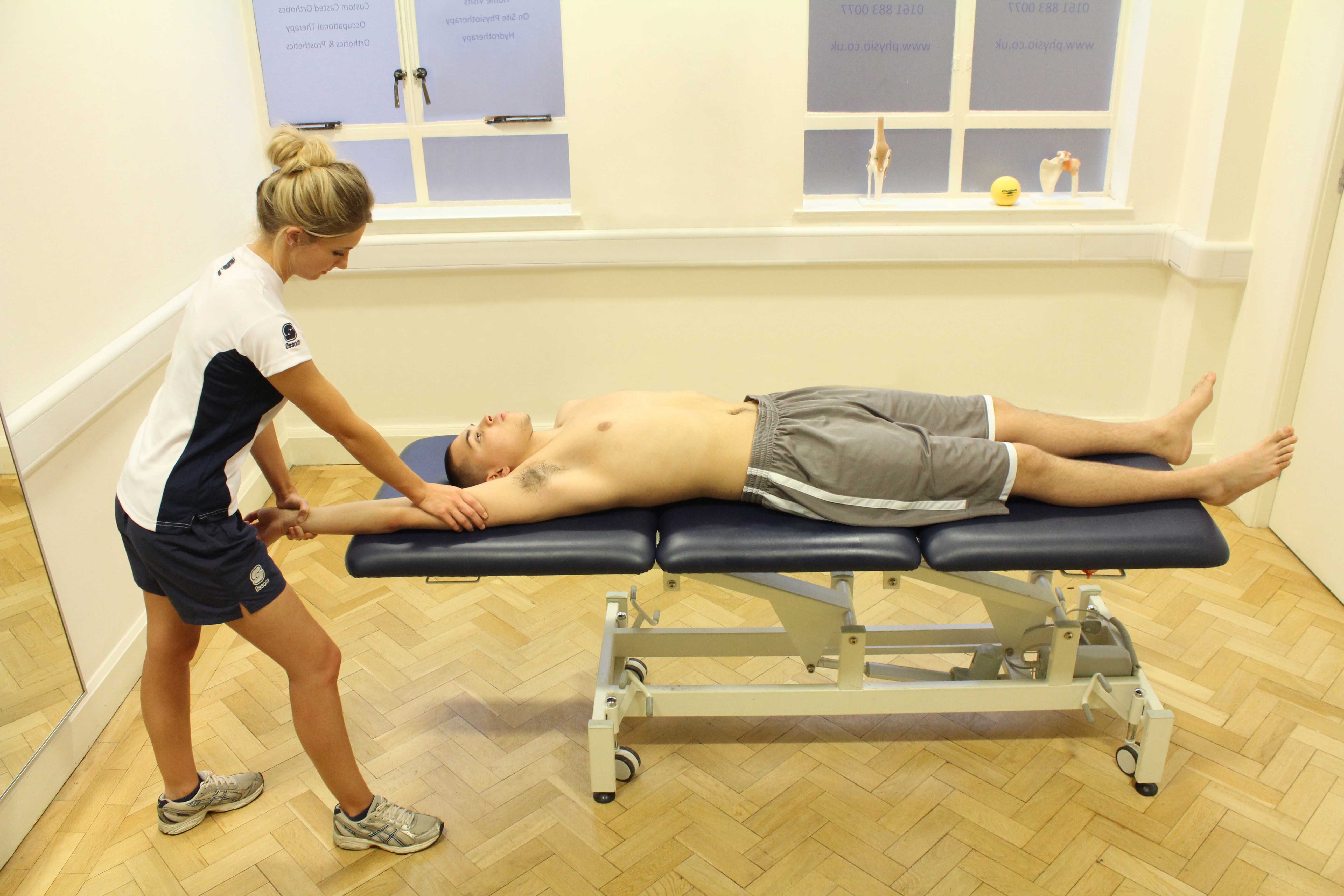 Soft tissue massage of the the connective tissues around the elbow