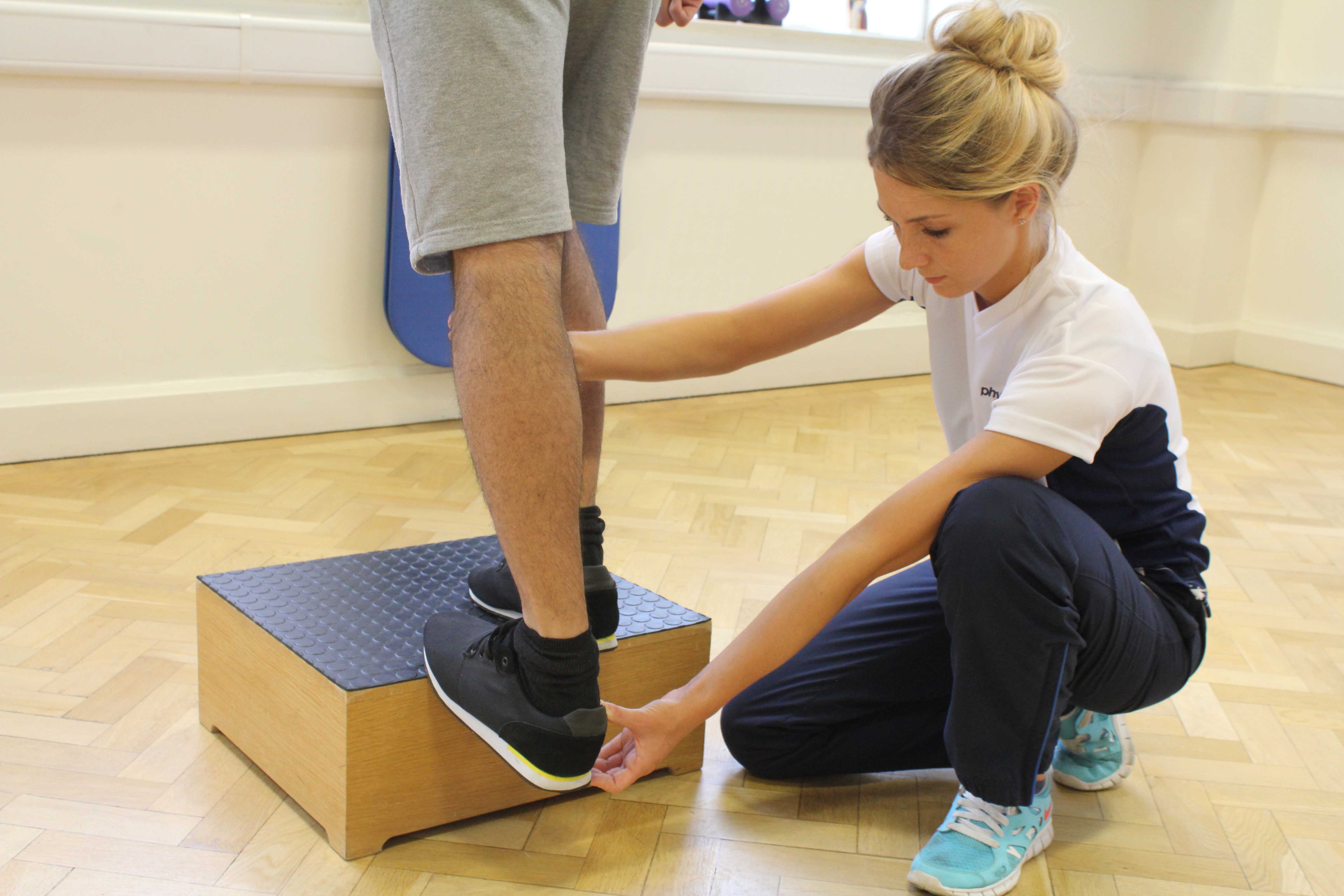 Progressive ankle strengthening exercises supervised by specialised therapist