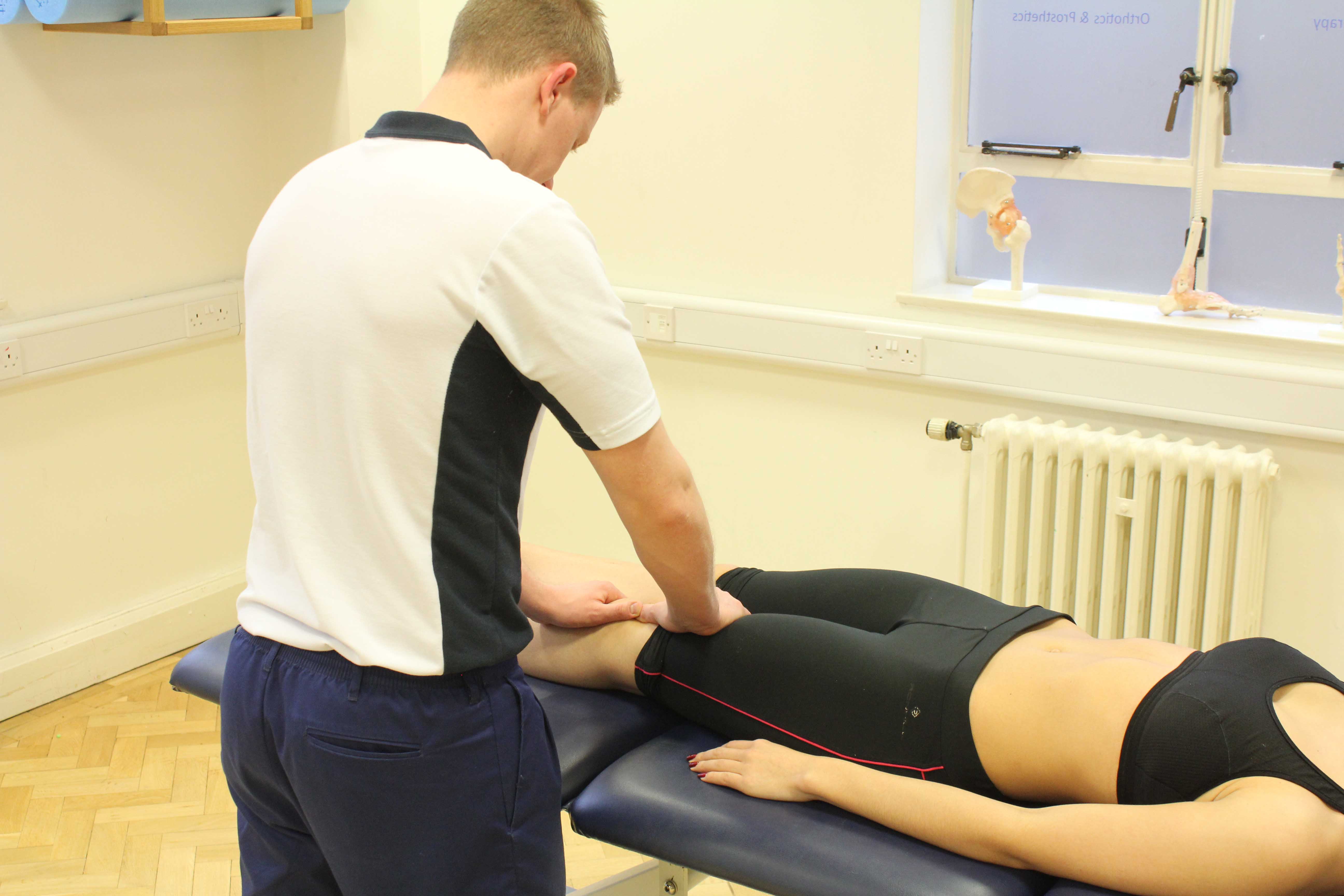 Therapist performing mobilisations on the patella, knee joint and surrounding connective tissue. Therapist performing mobilisations on the patella, knee joint and surrounding connective tissue.