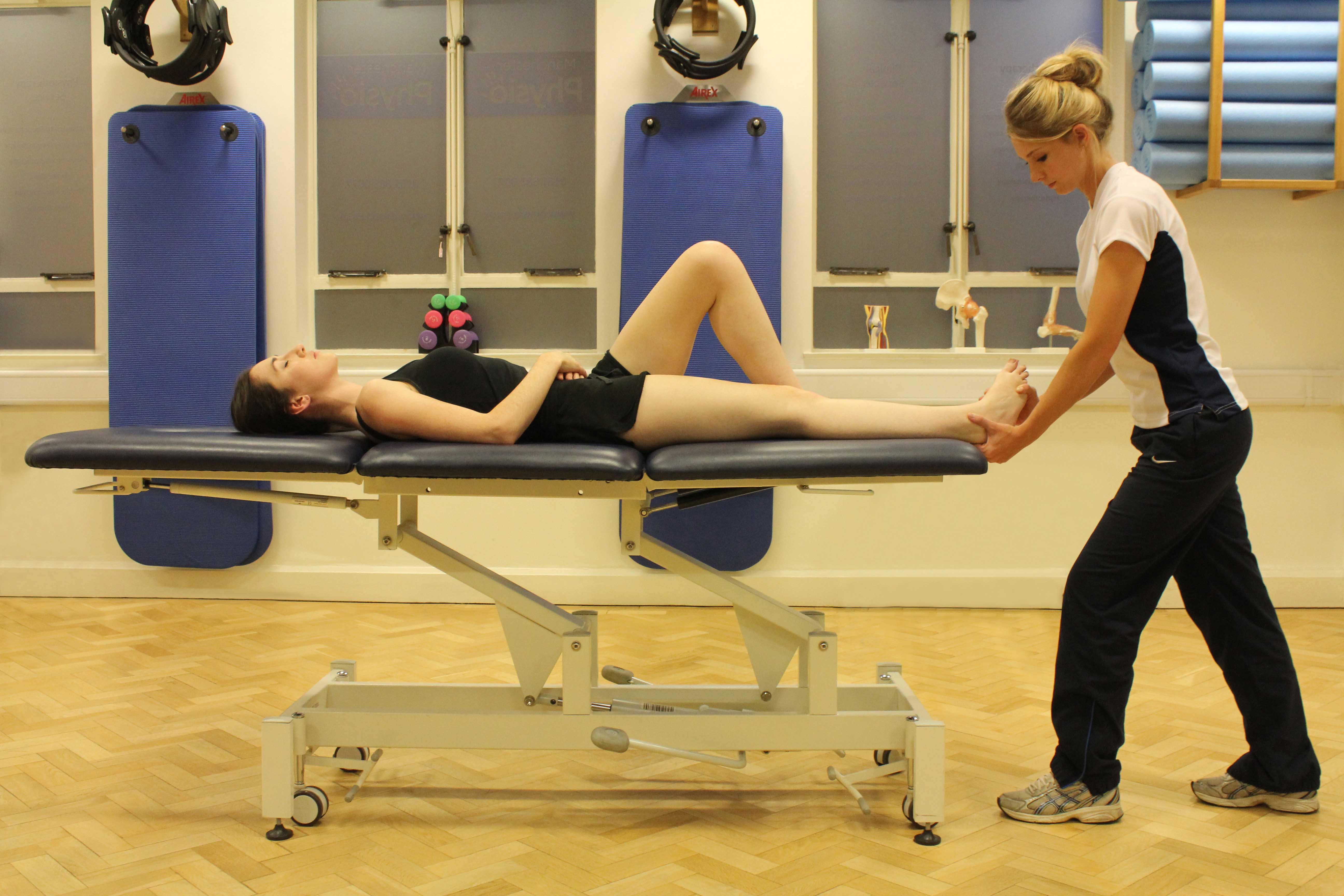 Passive stretch of the achilles tendon performed by specialist therapist