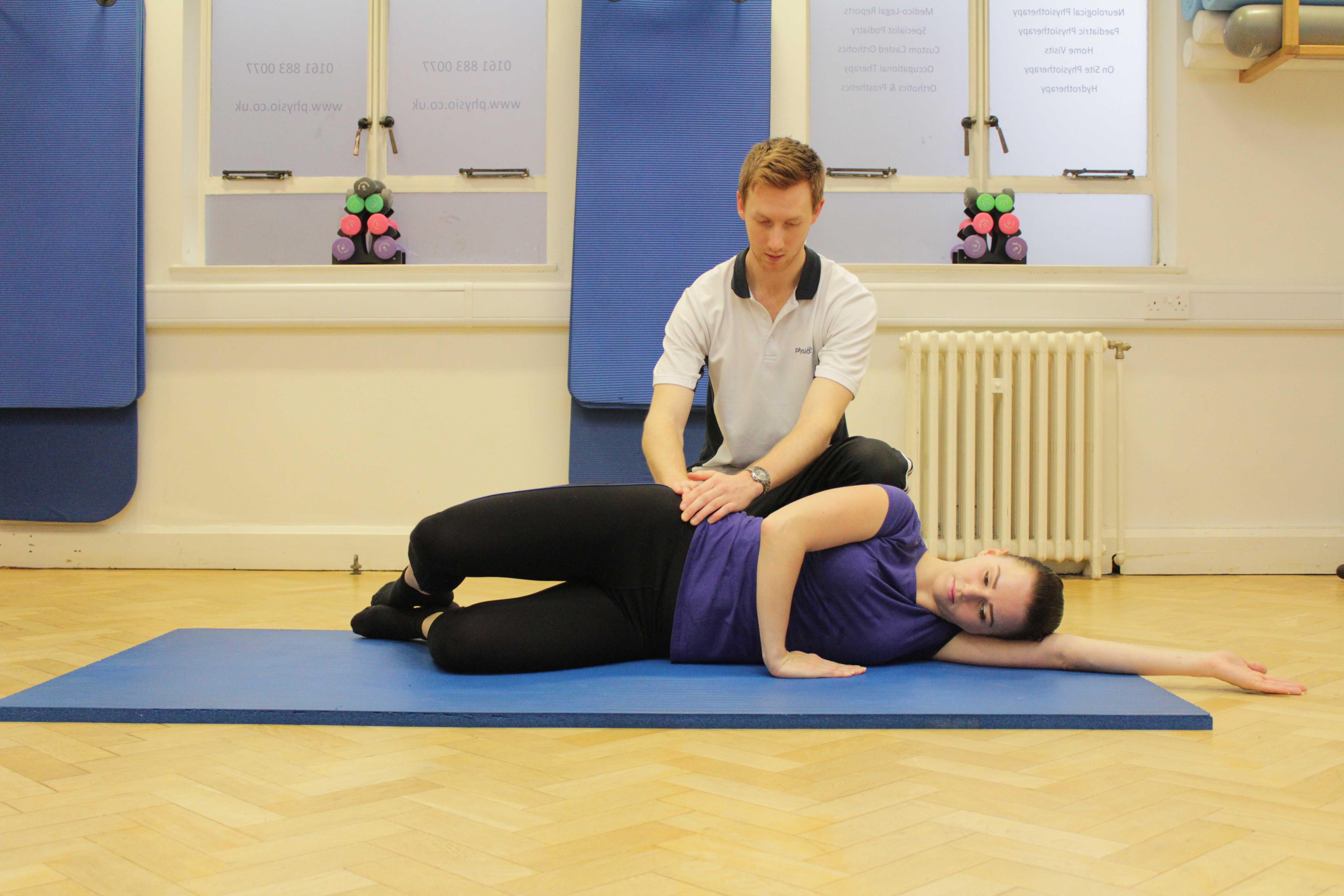 Strengthening exercises for the gluteus muscles supervised by a therapist Strengthening exercises for the gluteus muscles supervised by a therapist