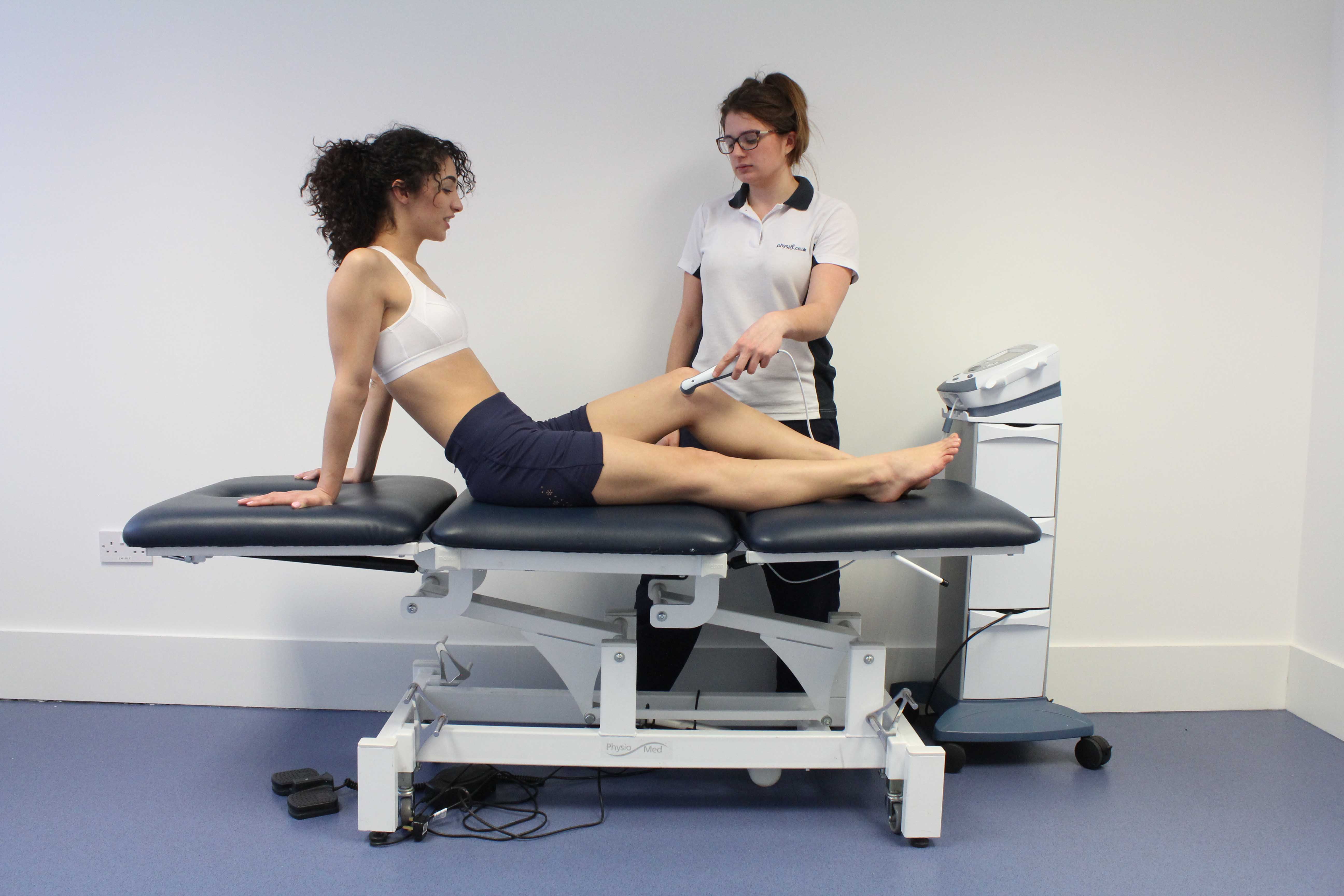 Ultrasound applied to the knee by specialist physiotherapist Ultrasound applied to the knee by specialist physiotherapist