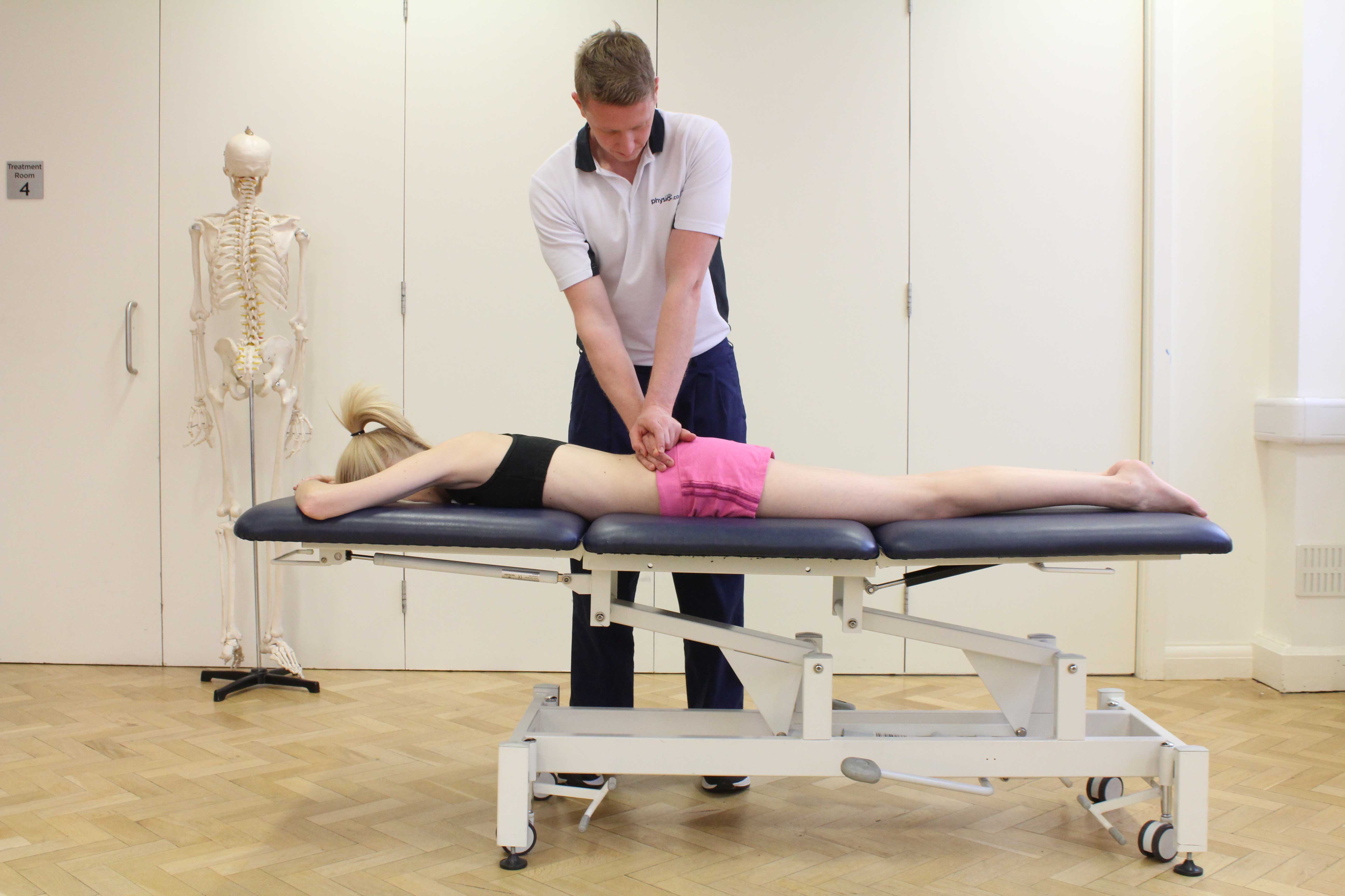 Mobilisations of the vertebrea in the lower back by experienced therapist