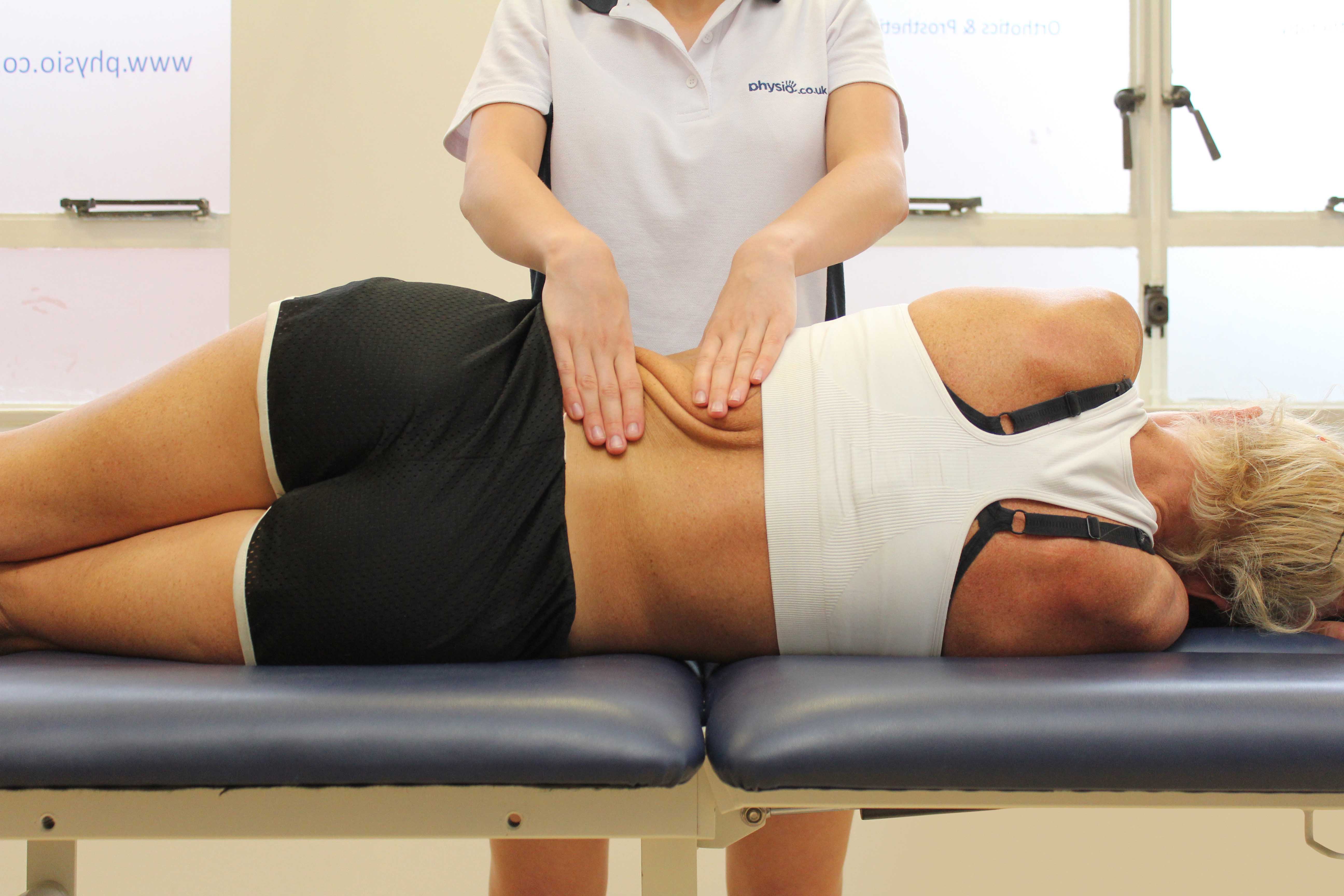 Rolling Soft Tissue Massage applied to the lower back by an experienced therapist