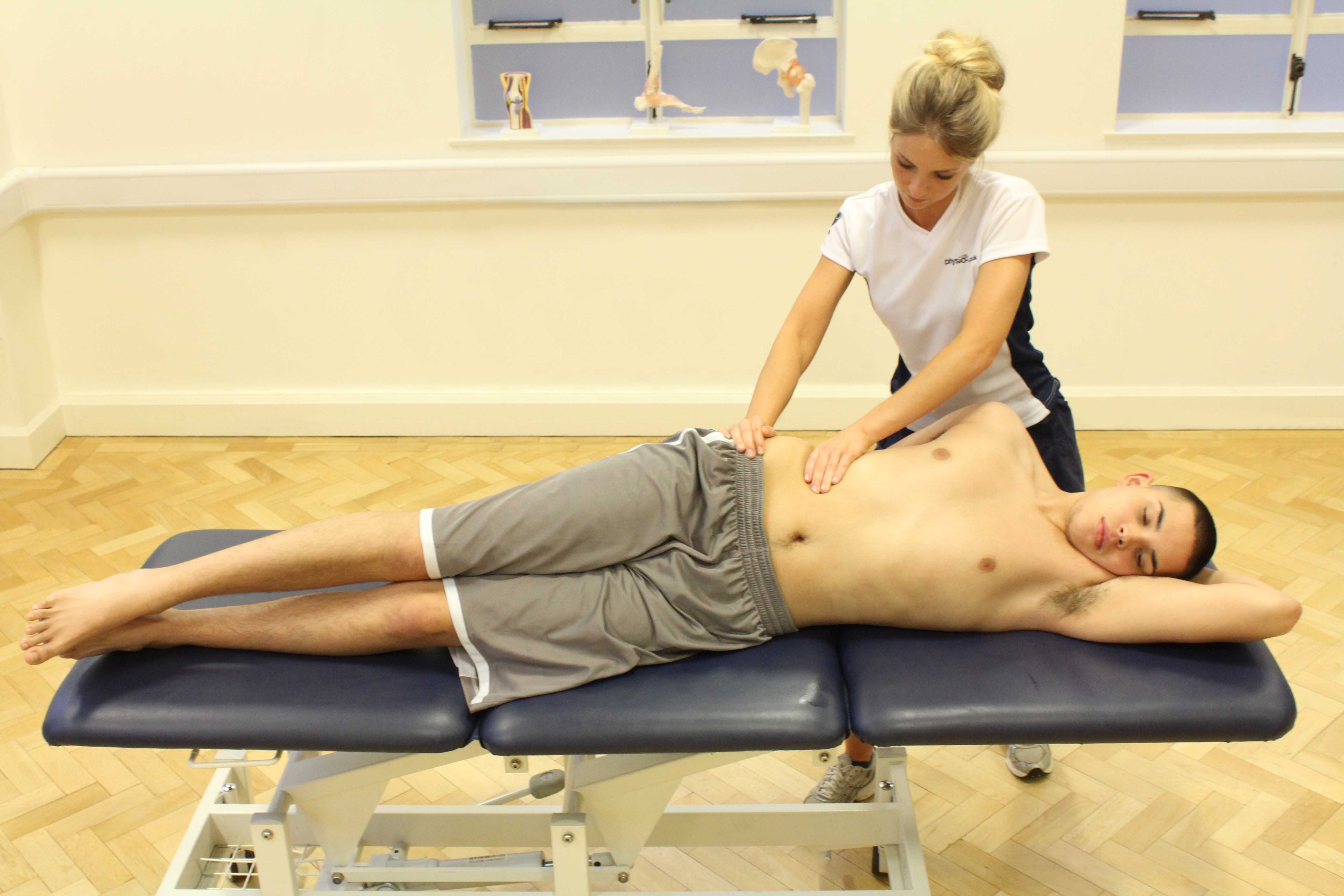 Soft tissue massage of abdominal oblique muscle