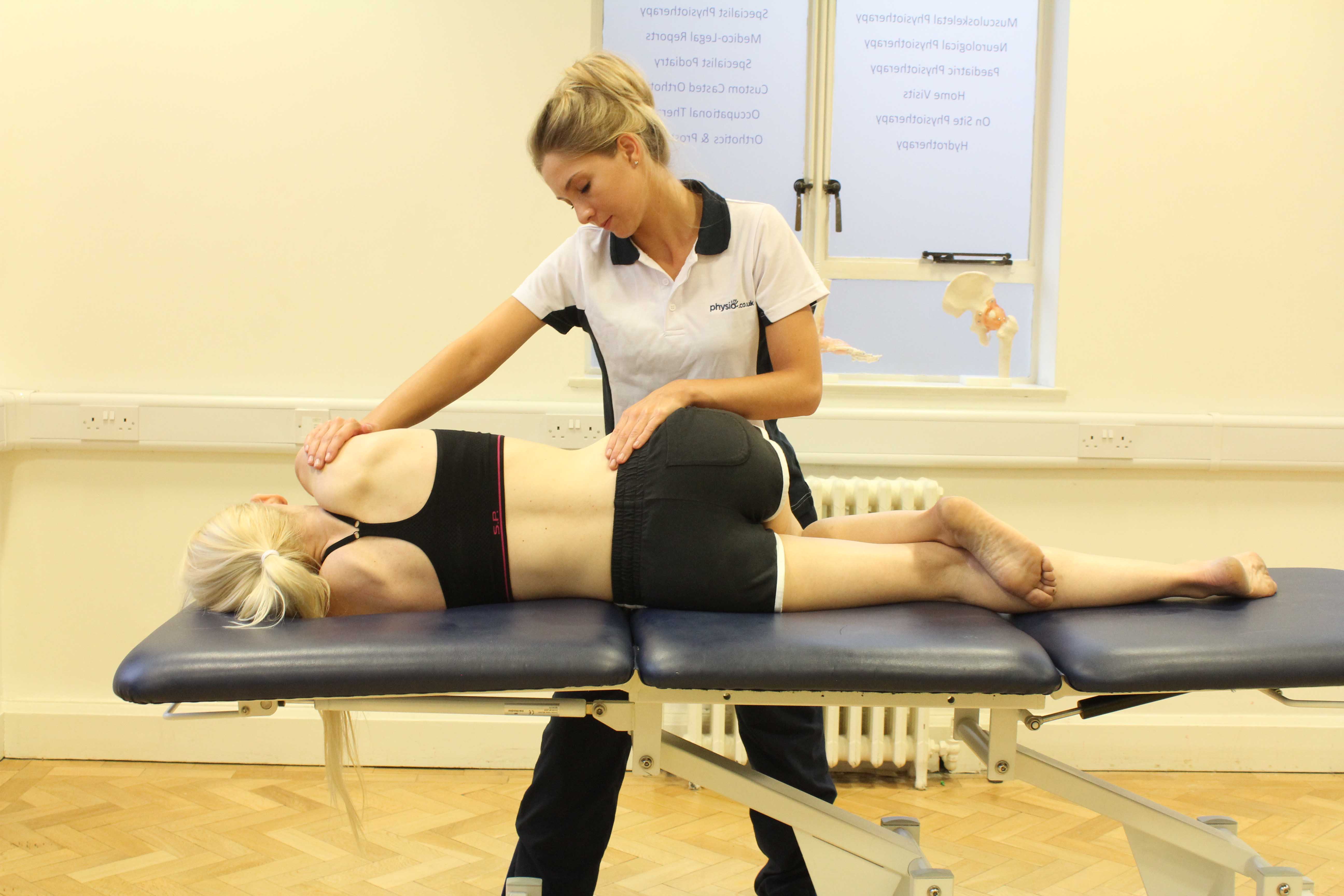 Transverse friction massage to the achielles tendon by a physiotherapist Transverse friction massage to the achielles tendon by a physiotherapist