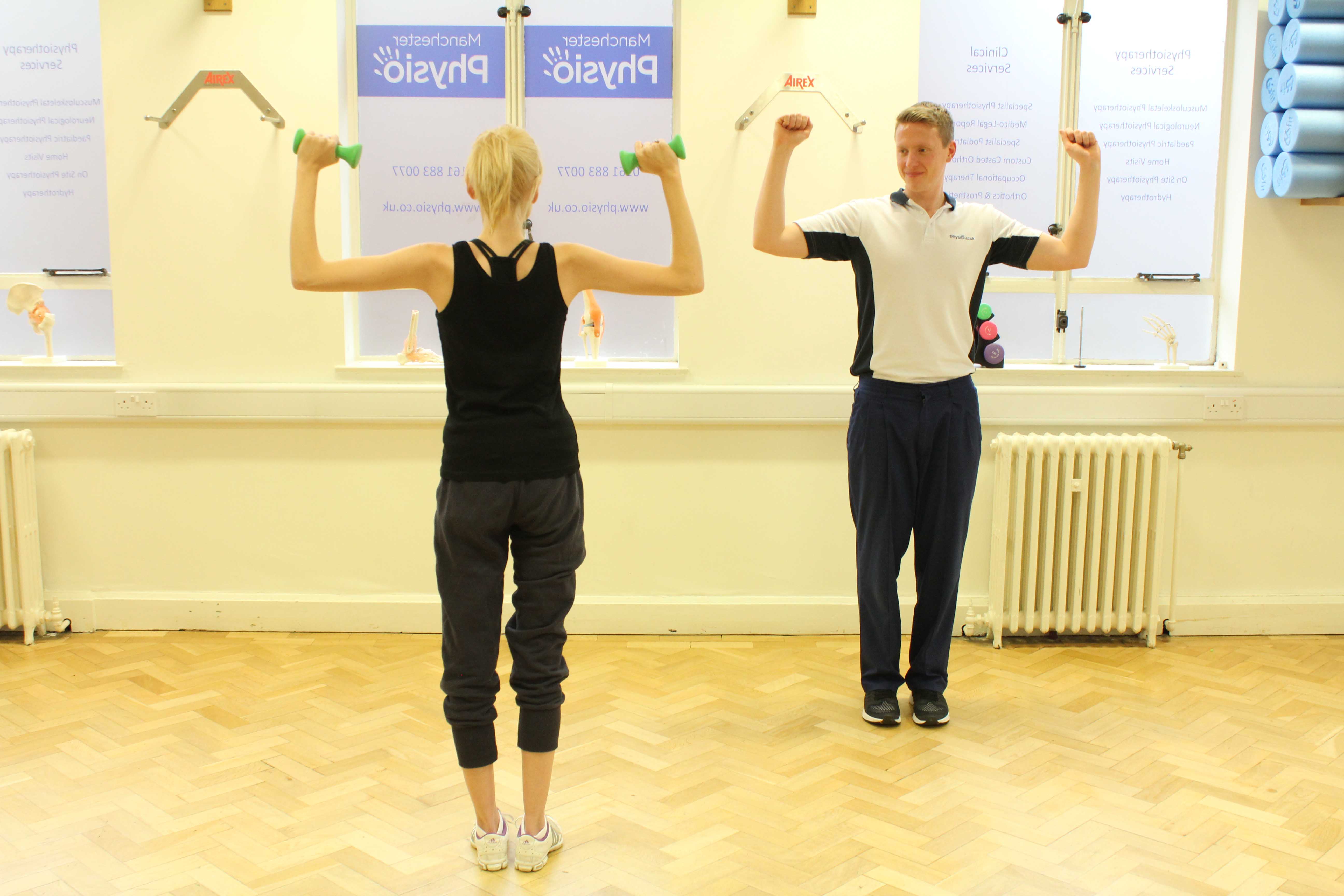Shoulder toning exercises supervised by experienced physiotherapist