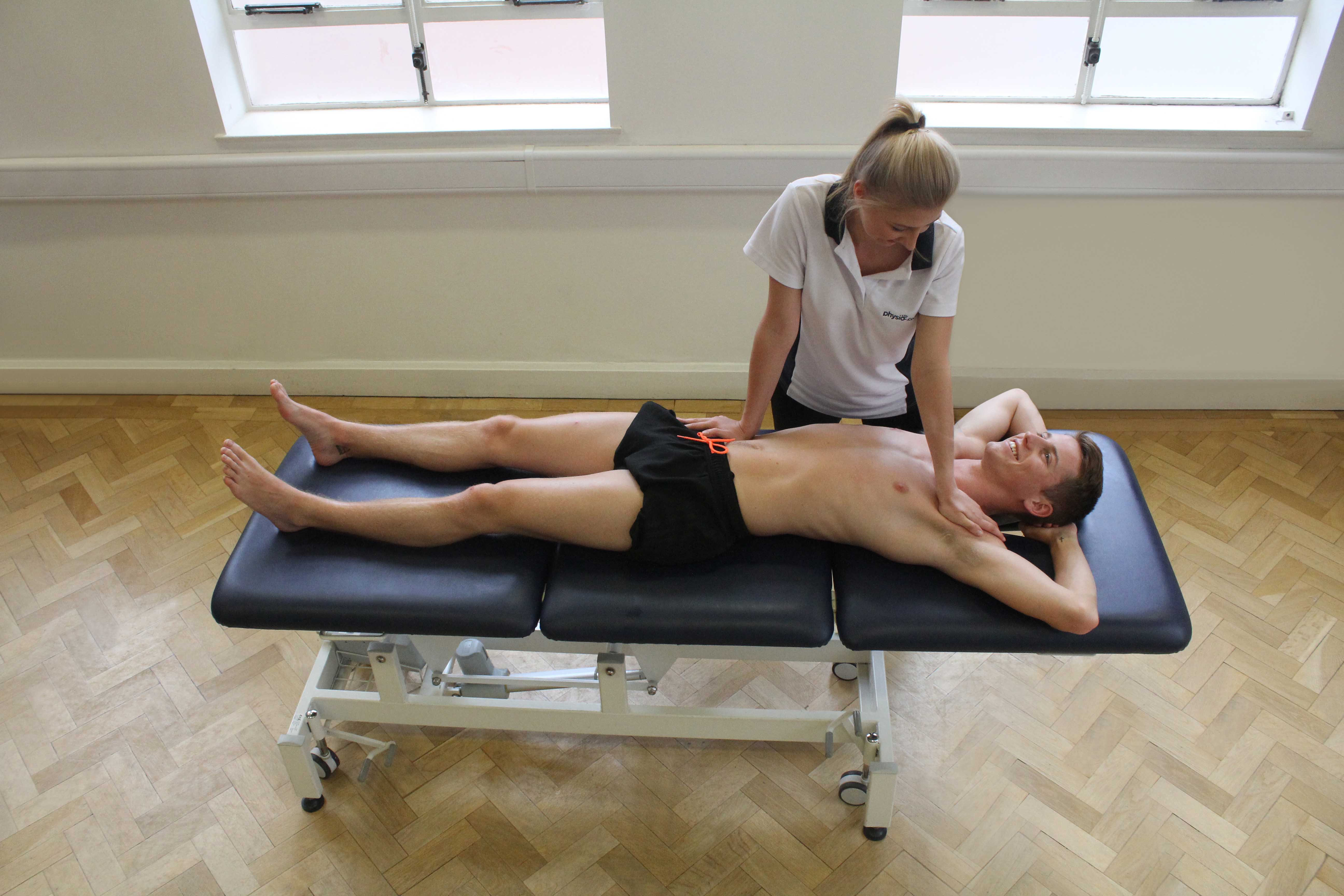 Passive stretch of the muscles and connective tissues of the hip and pelvis by specialist therapist Passive stretch of the muscles and connective tissues of the hip and pelvis by specialist therapist