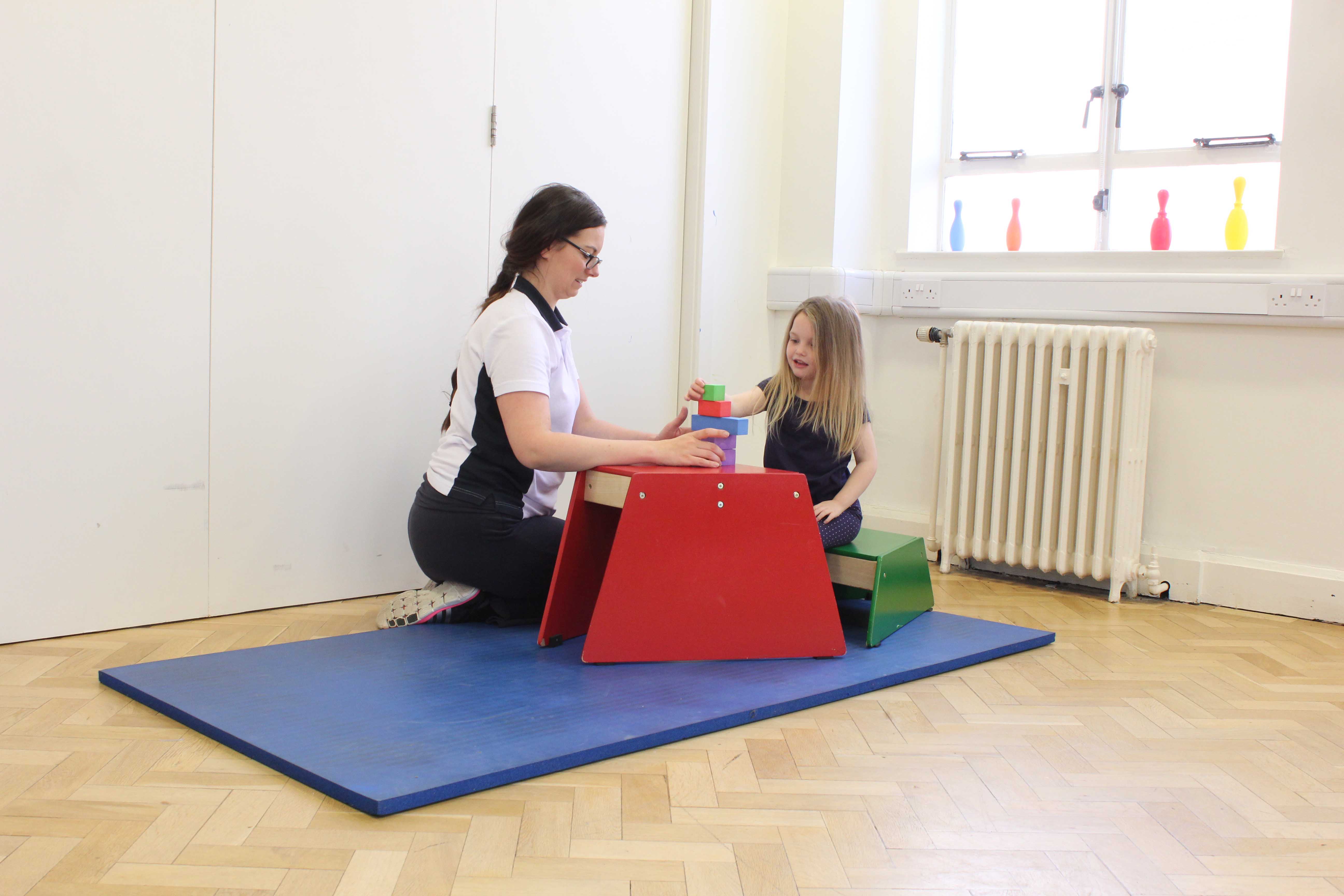 Fine motor skill exercises supervised by a specilaist neurological physiotherapist