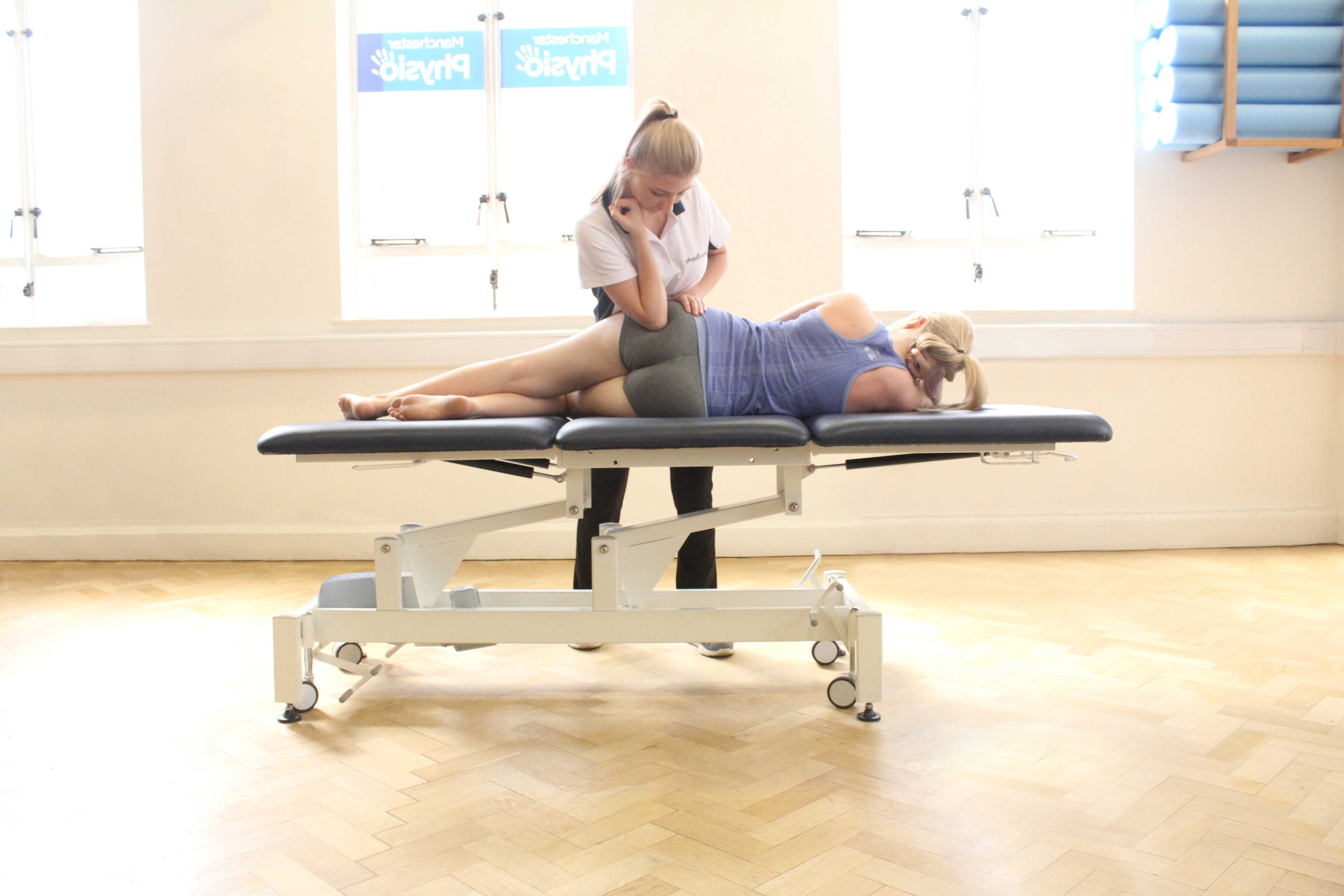 Deep tissue massage of the muscle and connective tissues around the hip. Deep tissue massage of the muscle and connective tissues around the hip.