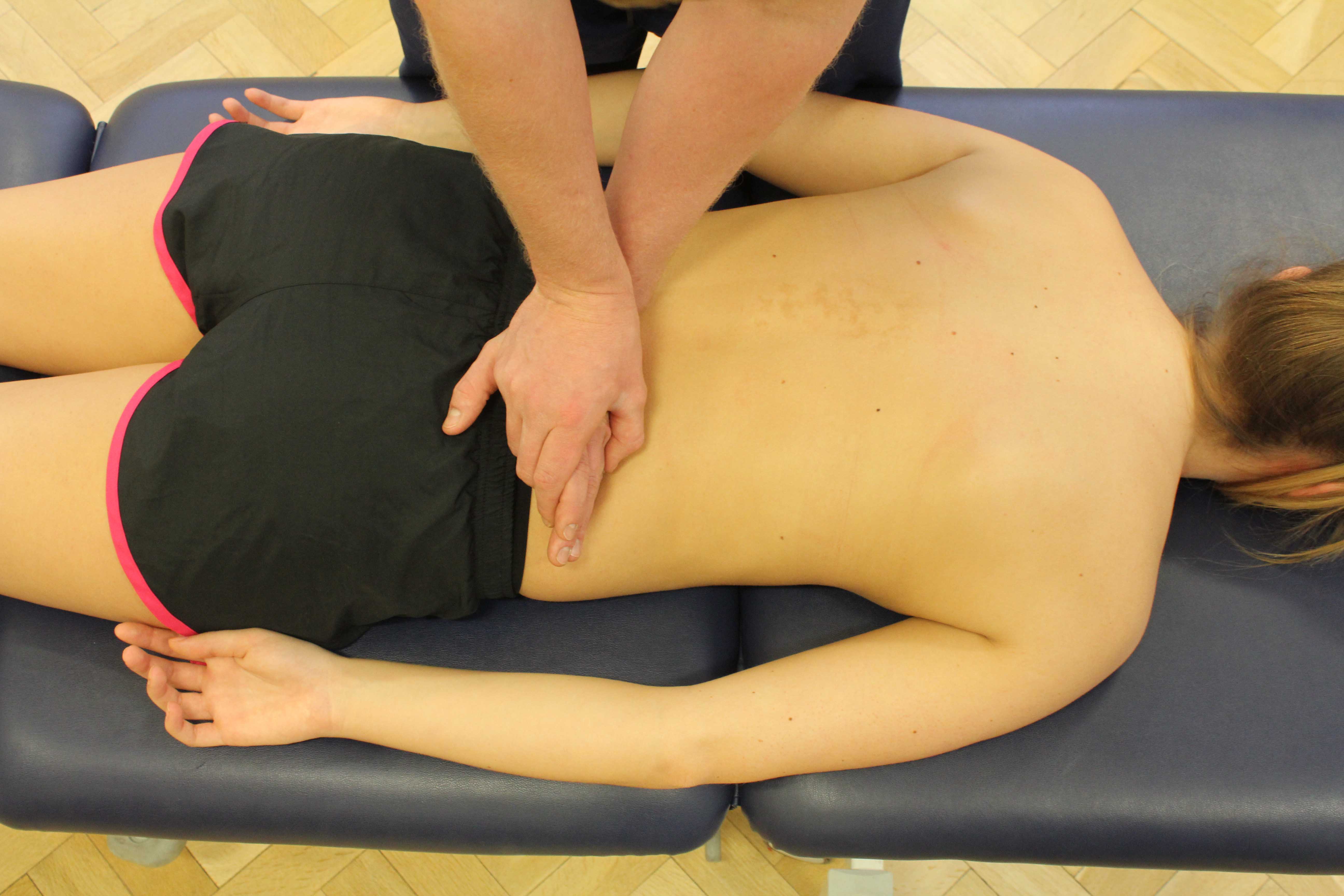 Mobilisations of the vertebrea in the lower back by experienced therapist