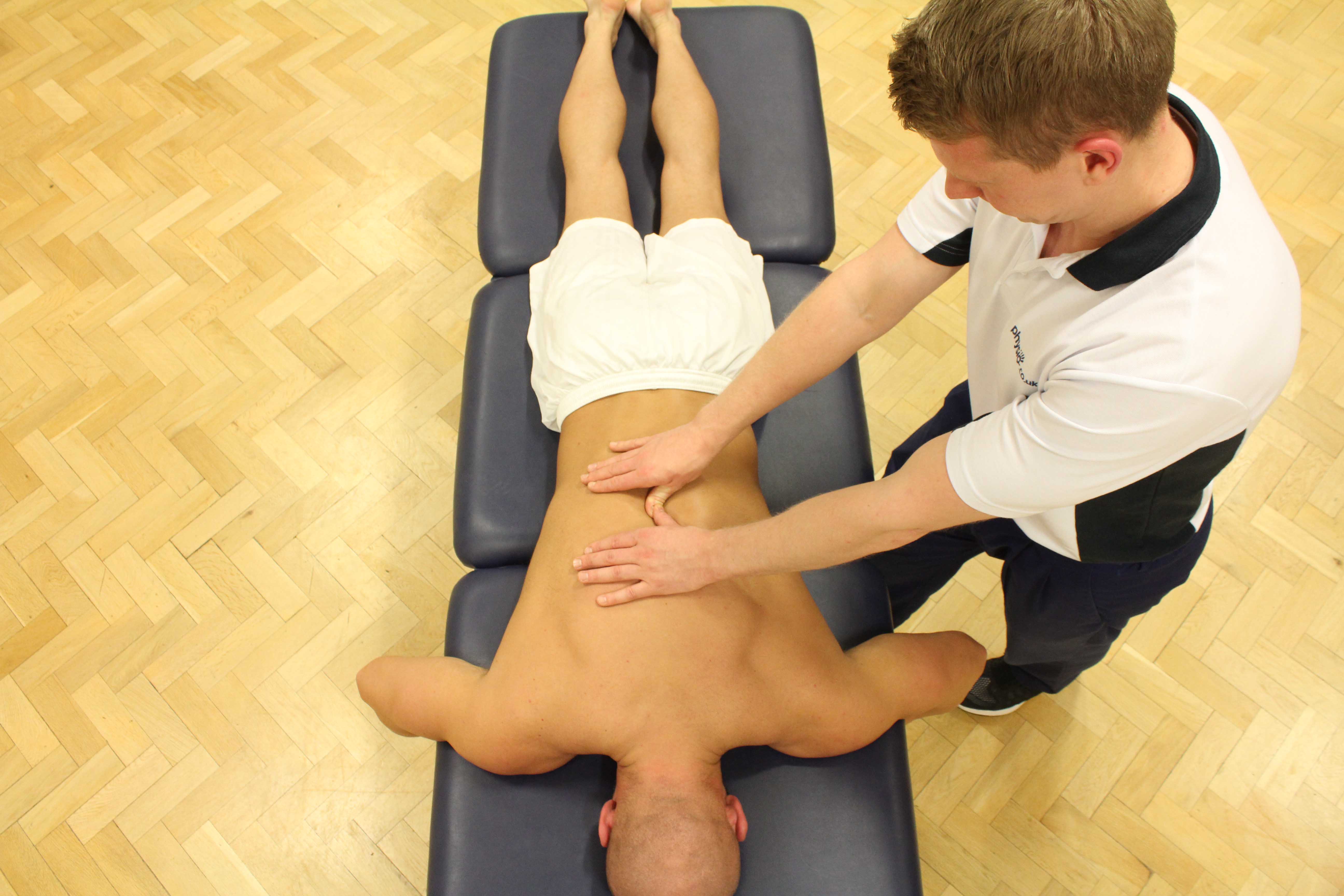 Mobilisations of the vertebrea in the lower back by experienced therapist