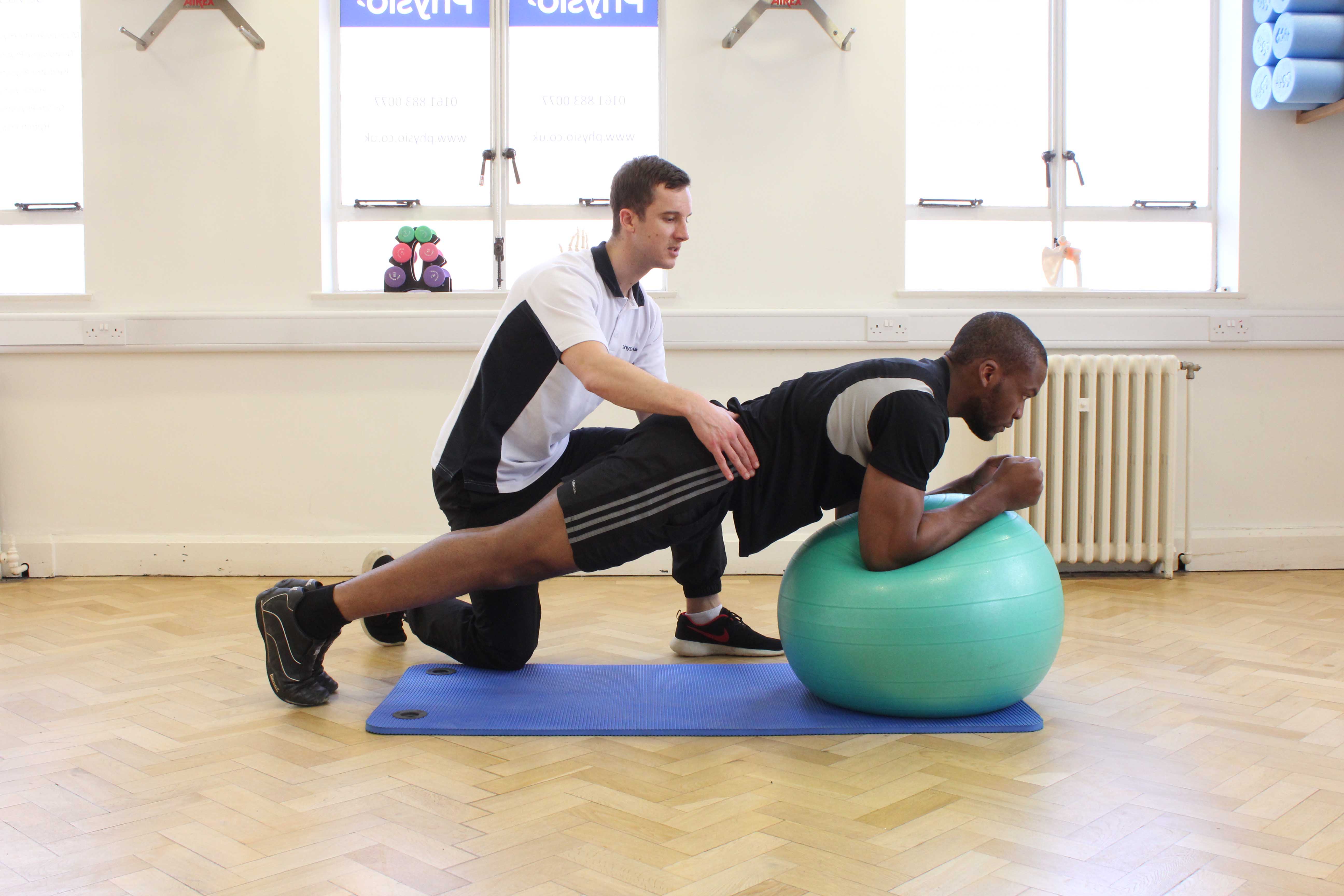 Progressive strengthening exercises for the lower back supervised by specialist MSK physiotherapist