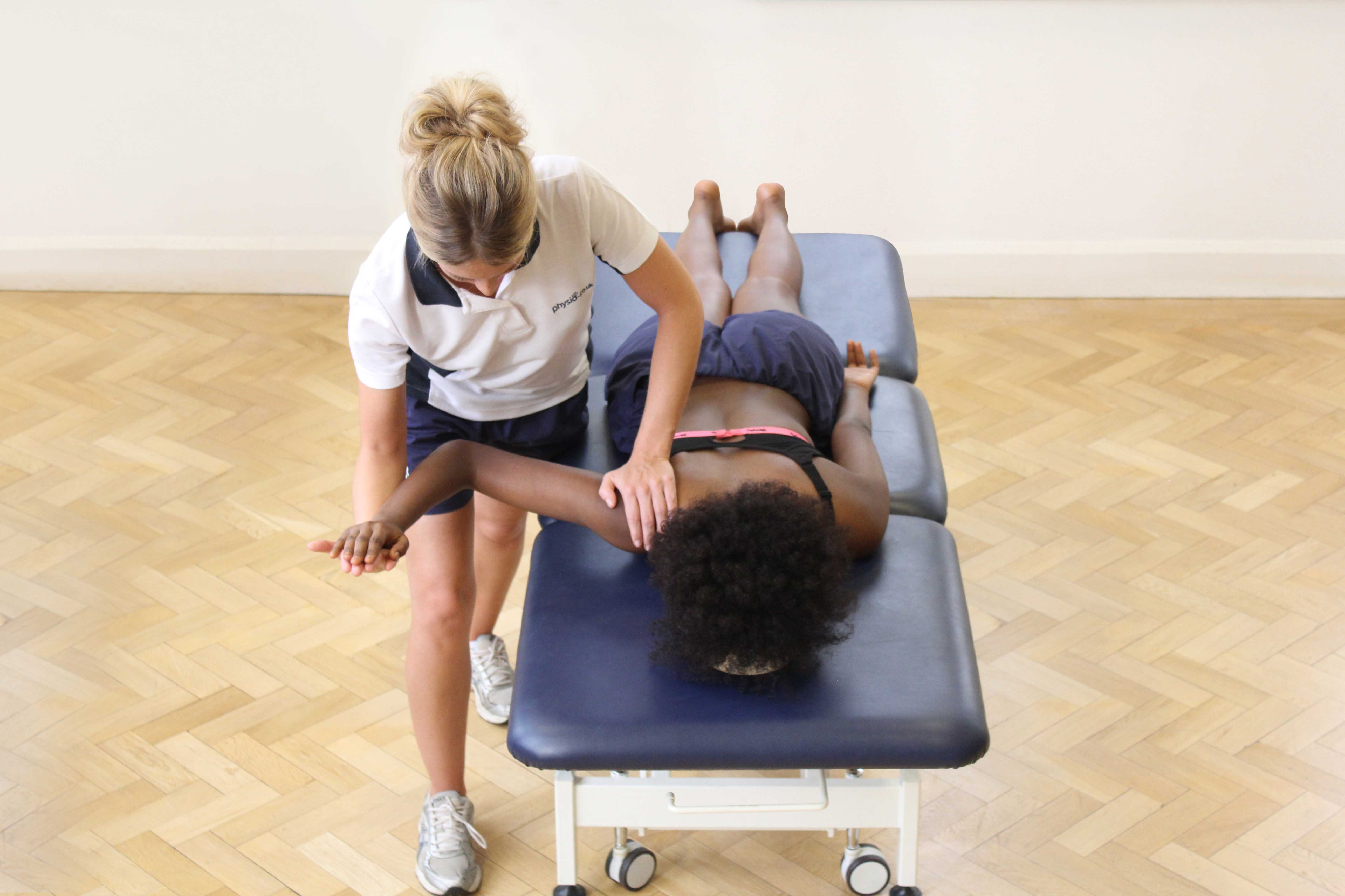Stretches of the shoulder joint performed by a therapist Stretches of the shoulder joint performed by a therapist