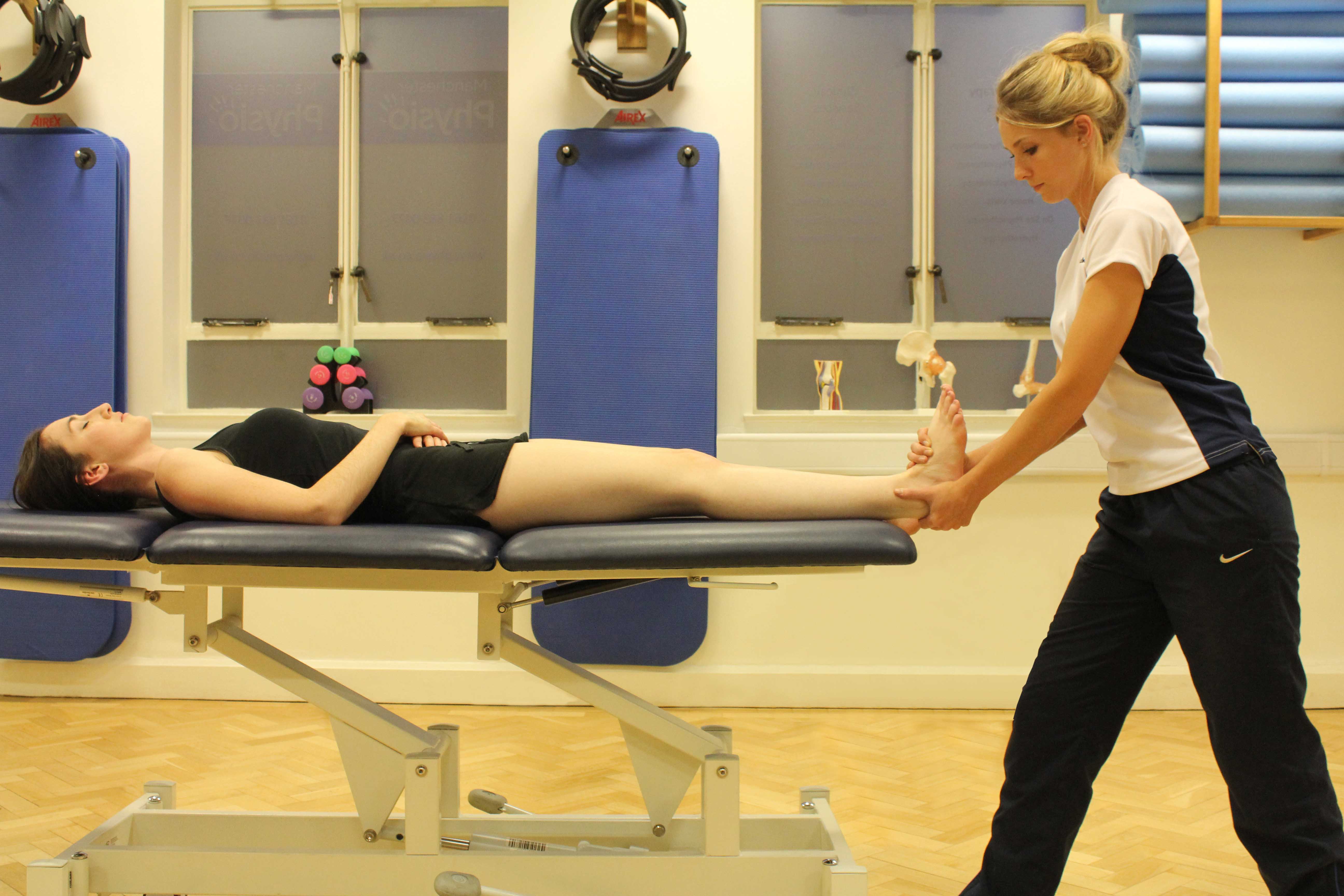 Passive stretch of the achilles tendon performed by specialist therapist