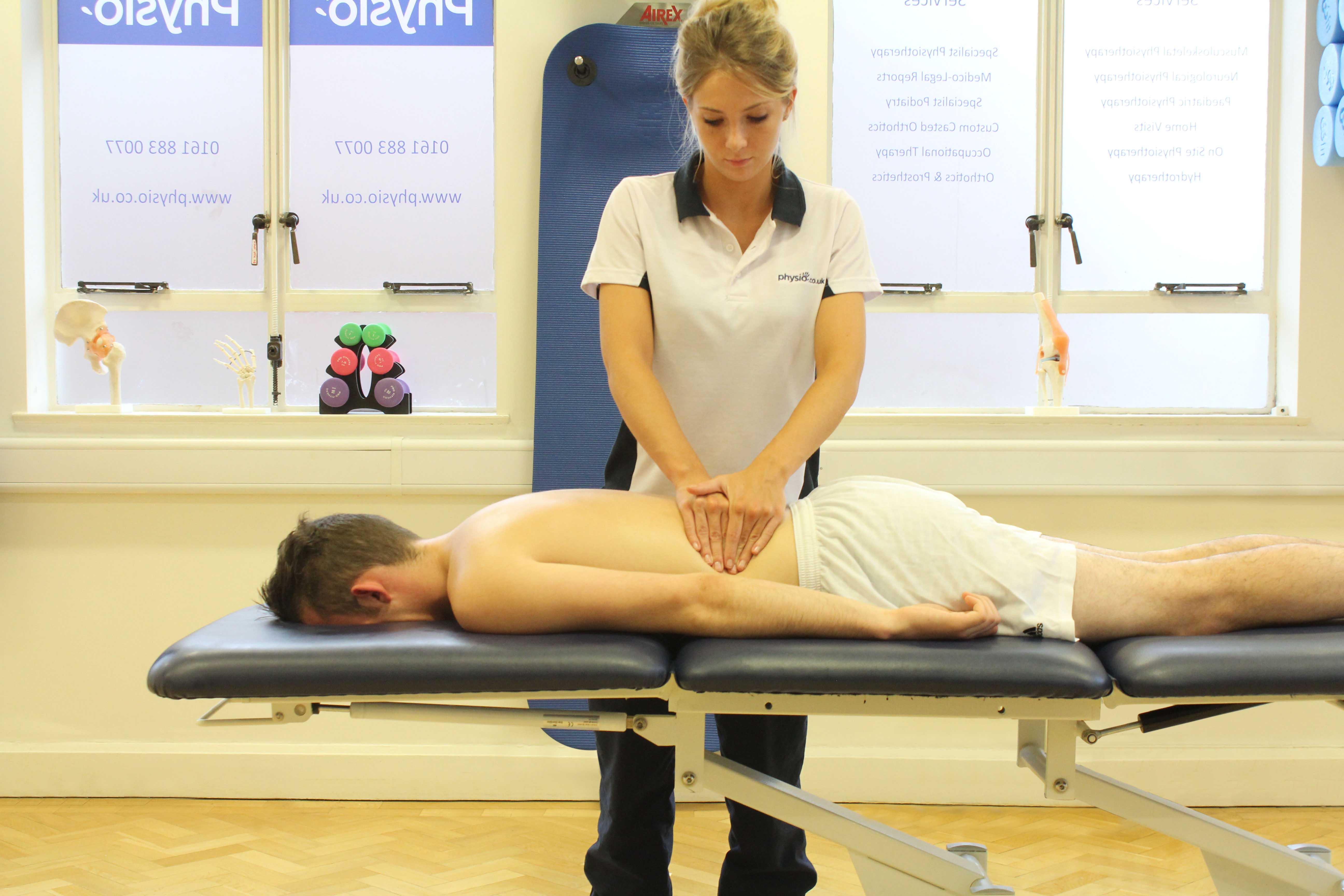 Deep tissue massage of the lower back by a specialist massage therapist