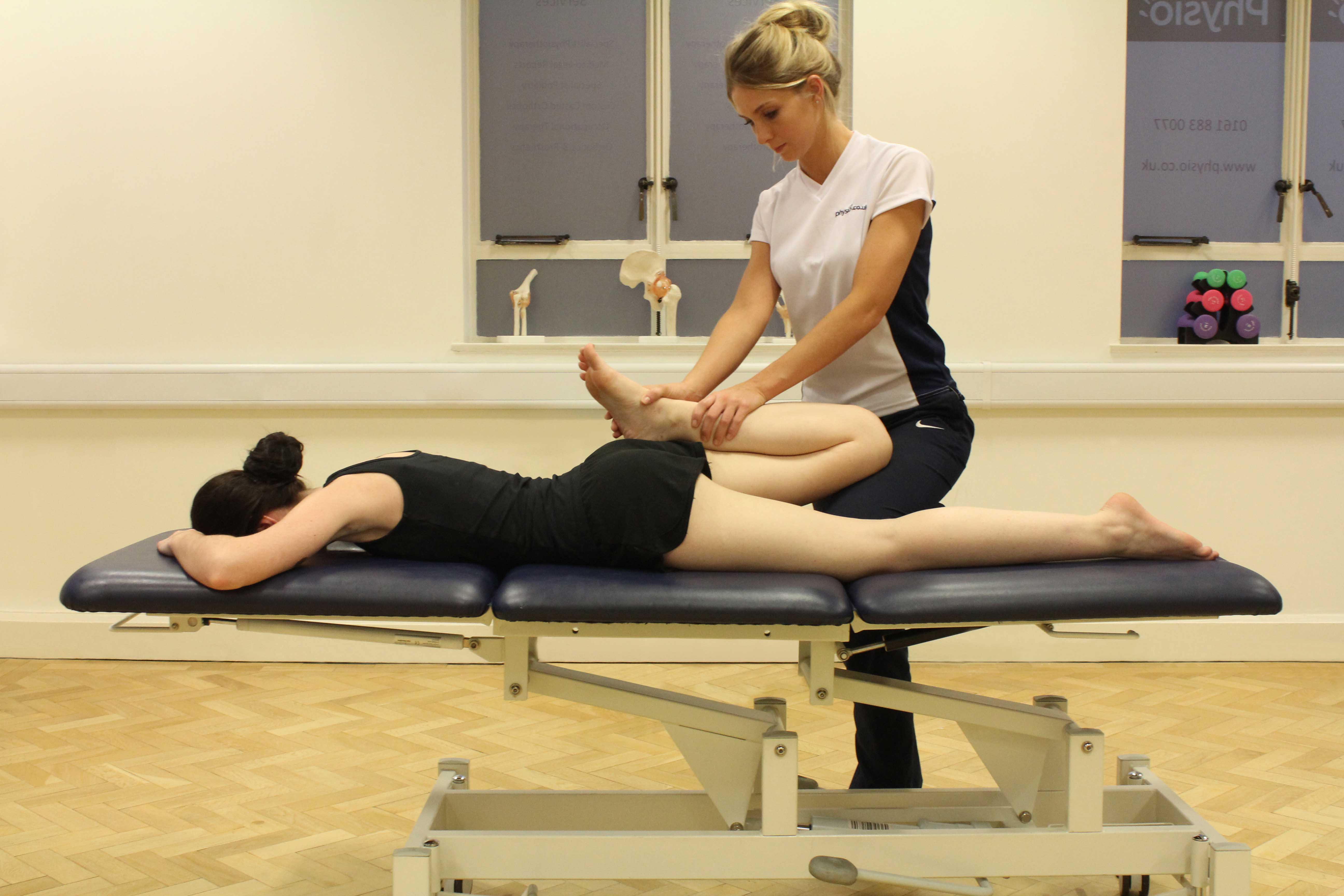 Passive stretch of the muscles and connective tissues of the hip and pelvis by specialist therapist