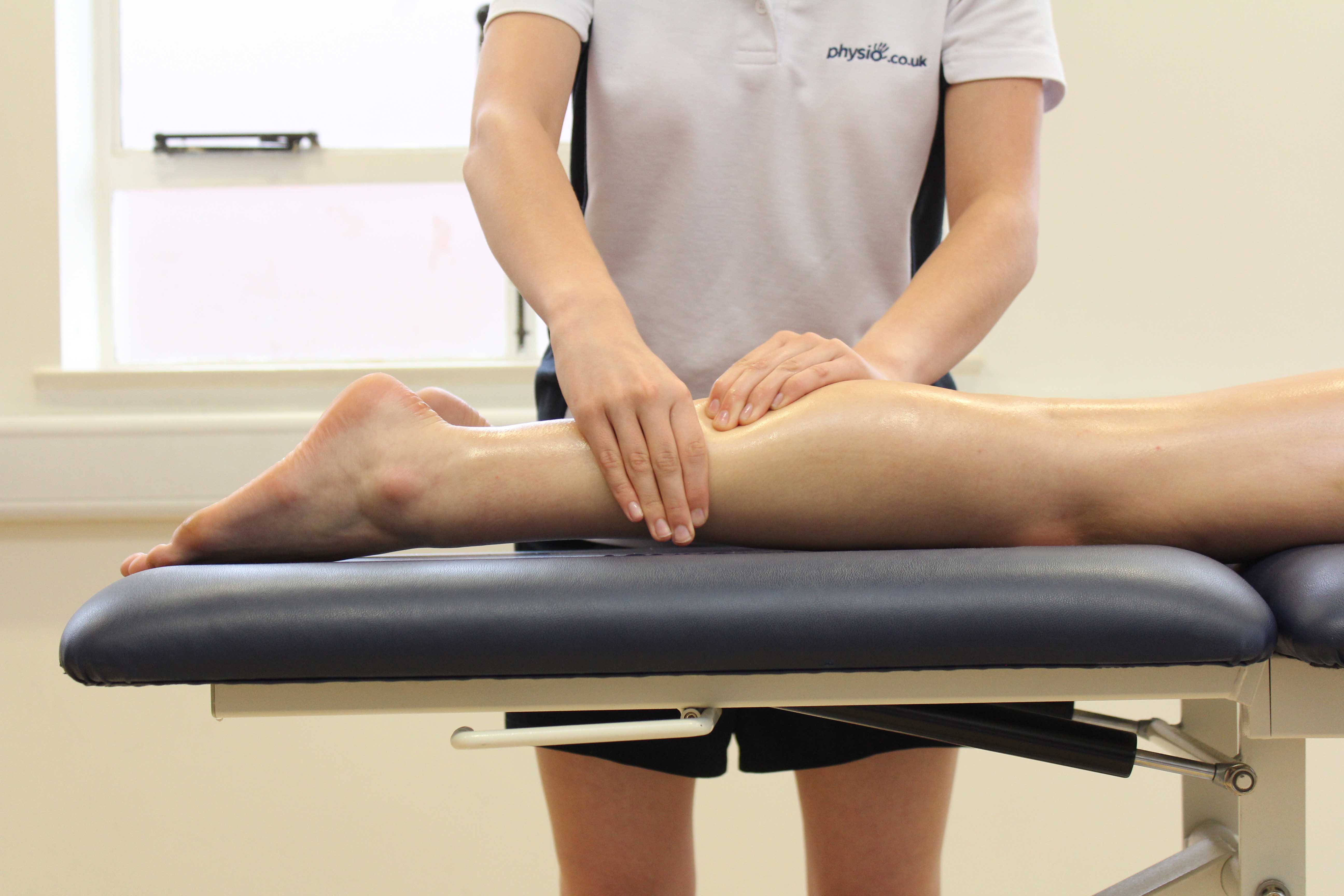 Rolling soft tissue massage of the gastroc nemius by a specilaist physiotherapist