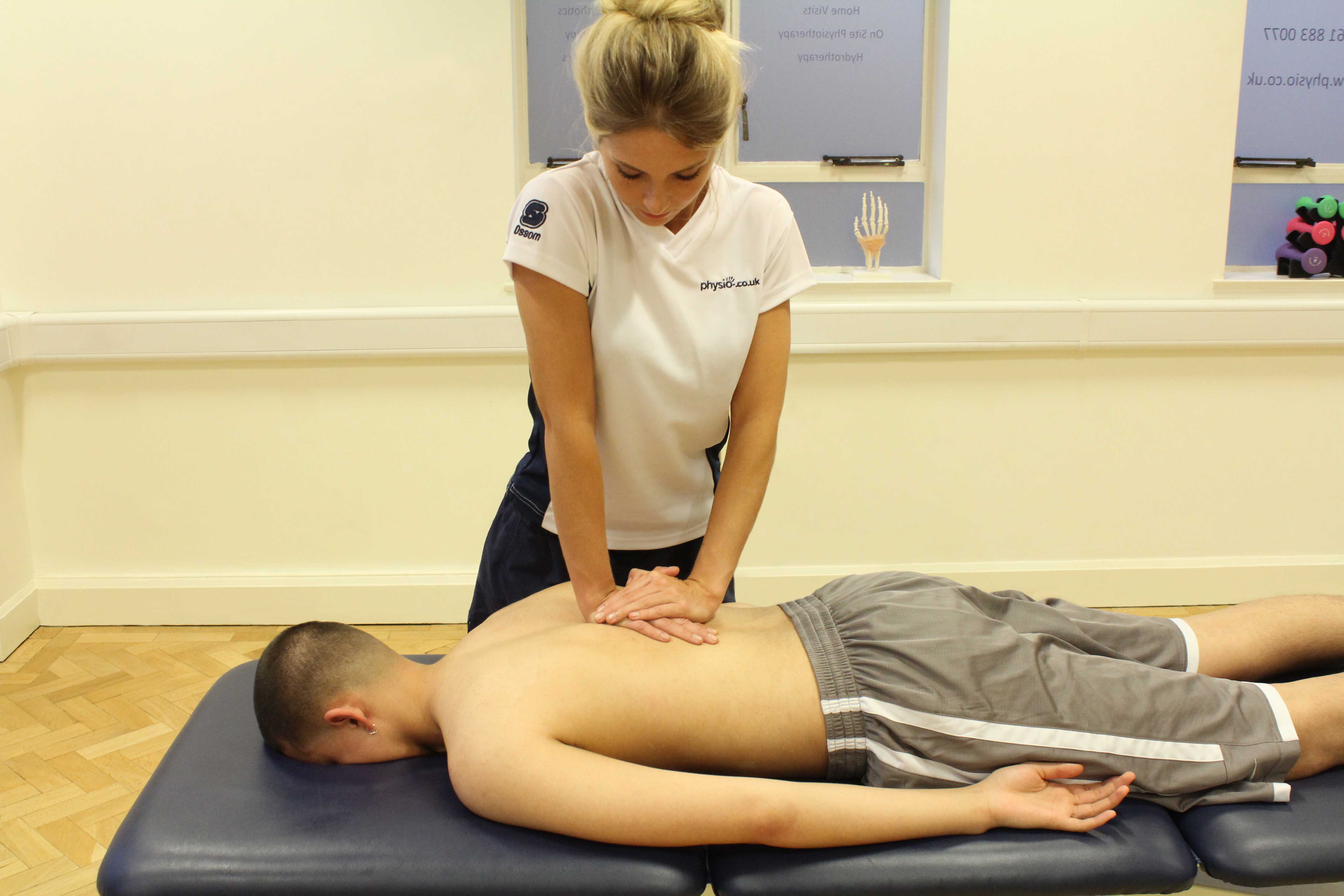 Soft tissue massage of the upper thoracic spine Soft tissue massage of the upper thoracic spine