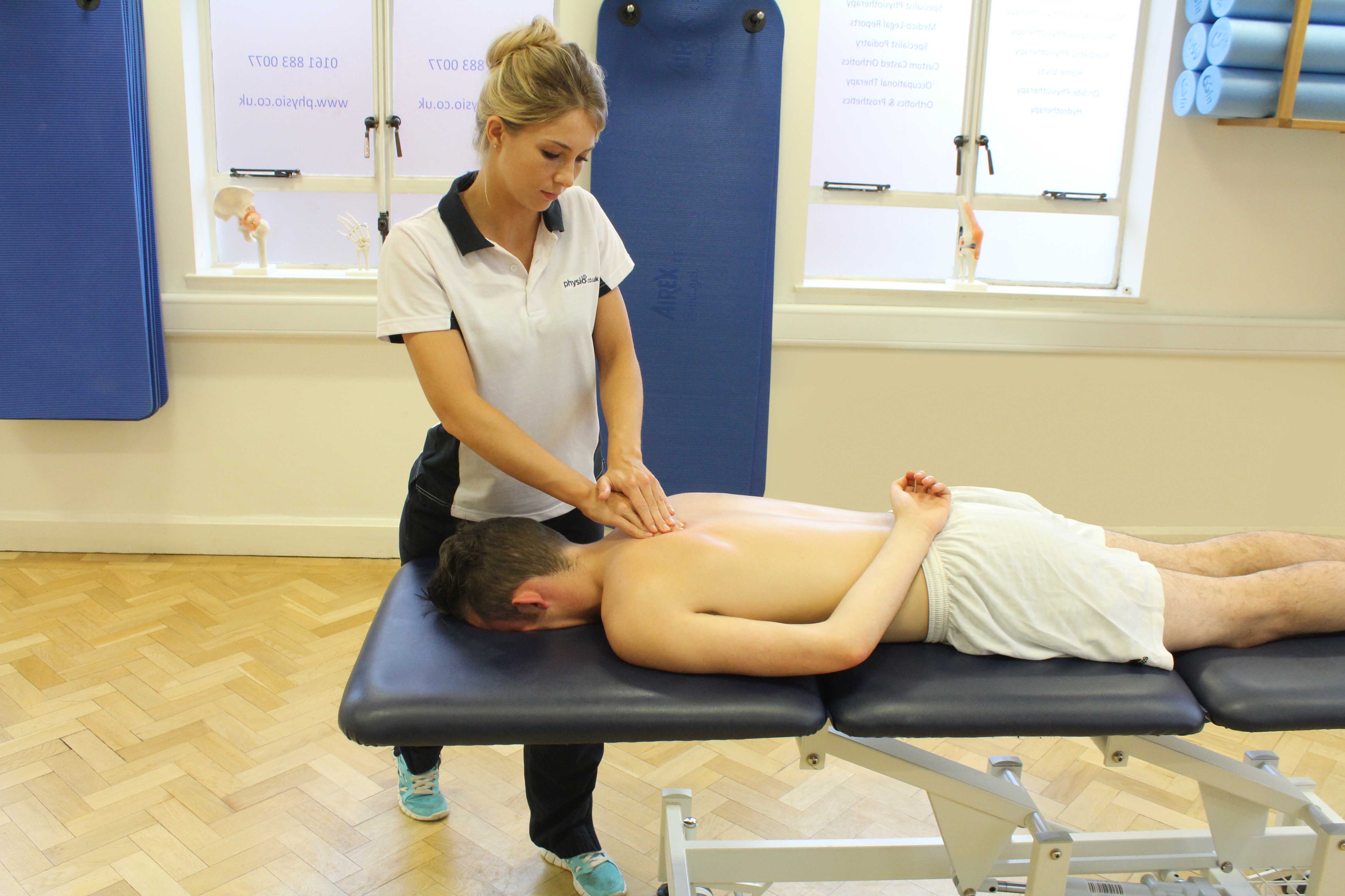 Soft tissue massage of the upper back muscles Soft tissue massage of the upper back muscles