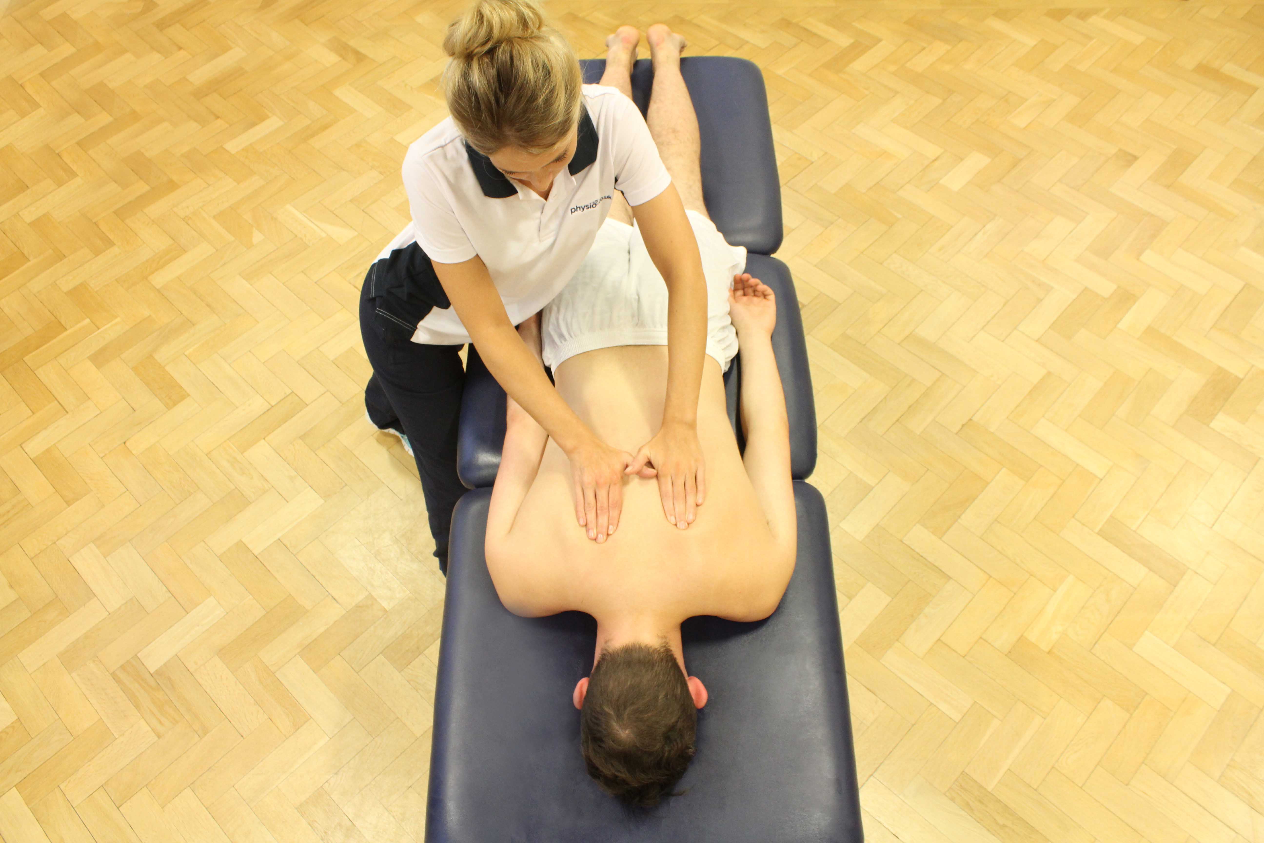 Soft tissue massage of the upper thoracic spine Soft tissue massage of the upper thoracic spine