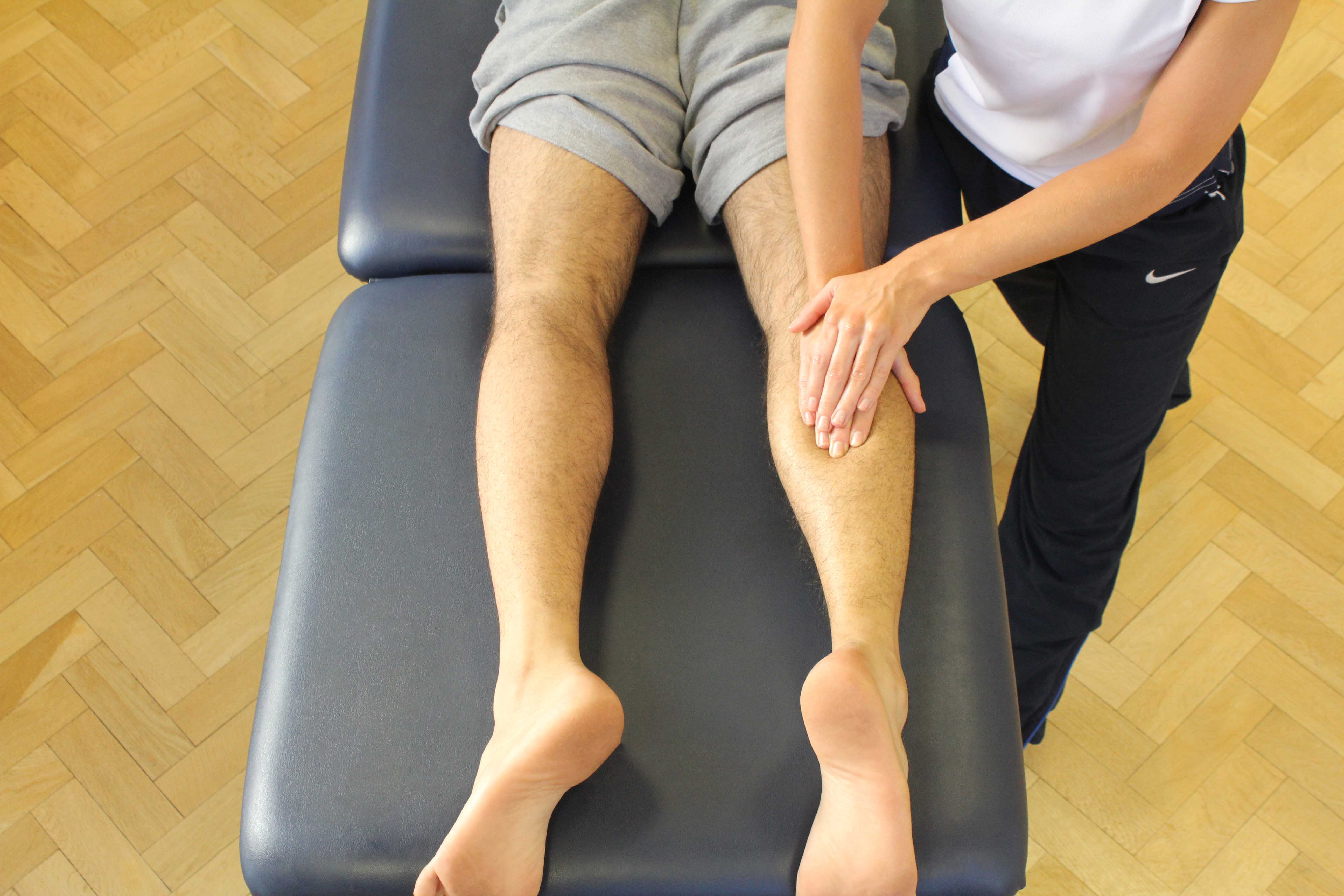 Soft tissue massage of the gastrocnemius muscle by MSK therapist