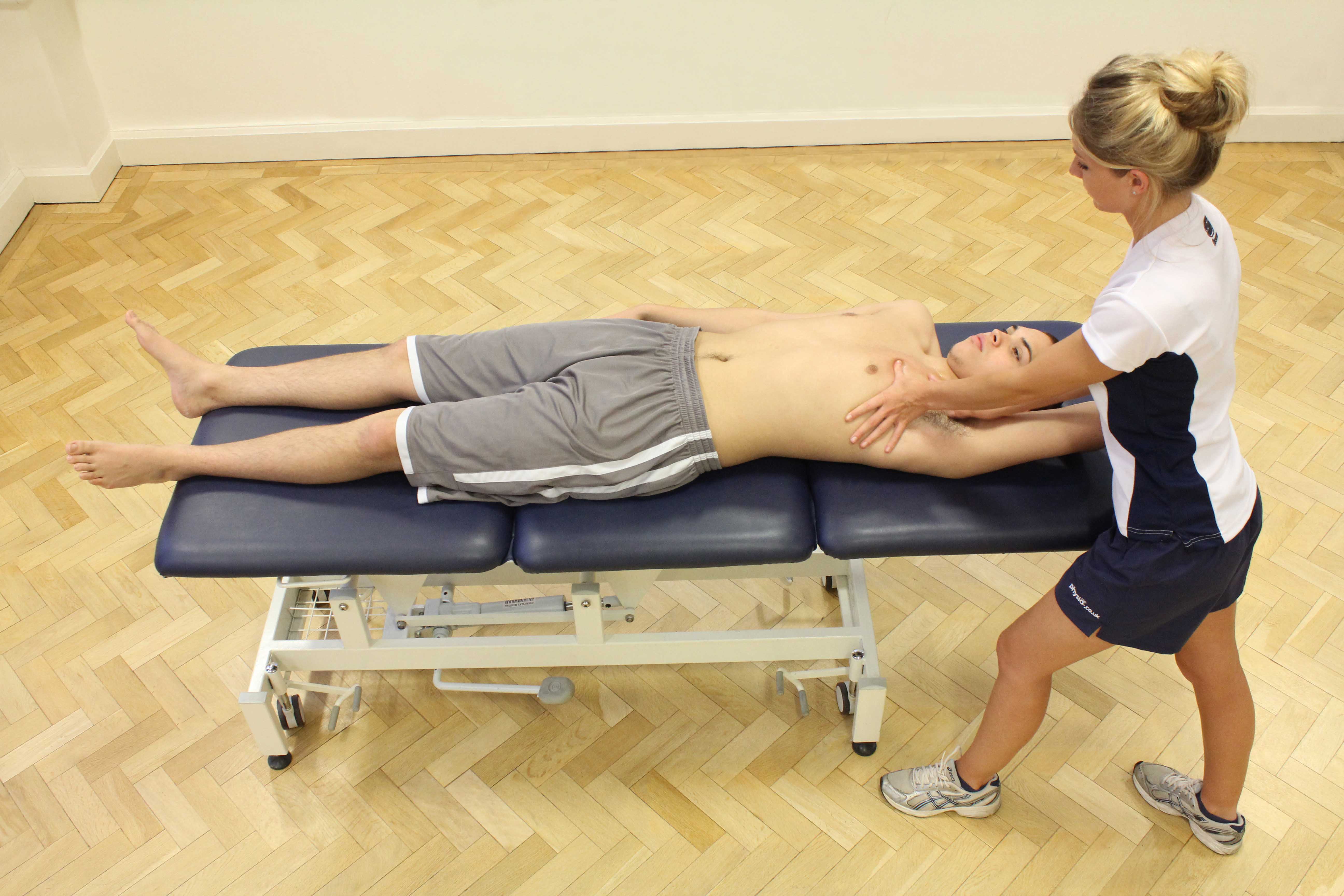 Soft tissue massage of the pectrol muscle by experienced therapist Soft tissue massage of the pectrol muscle by experienced therapist