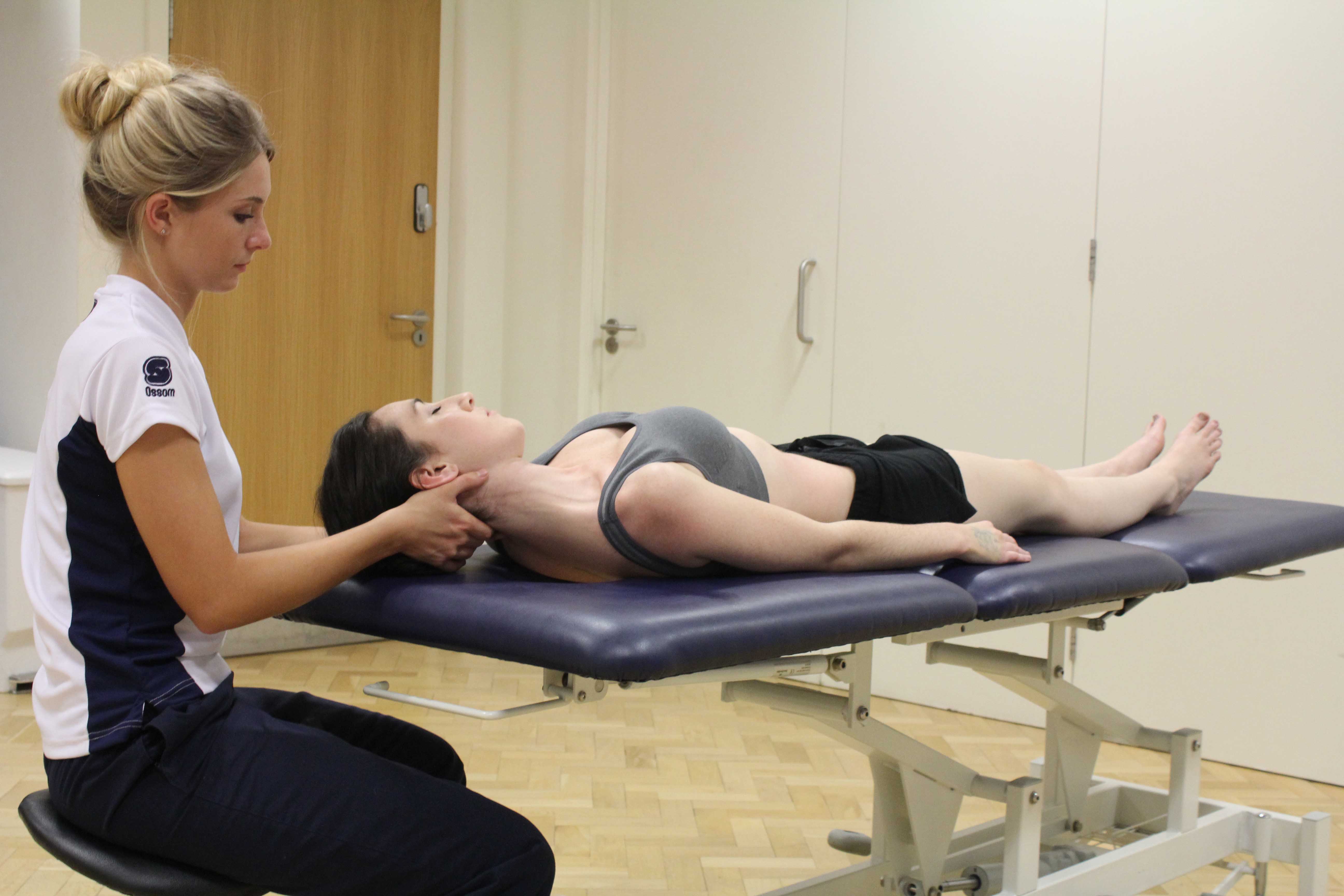 Stretches and realignment of the cervical spine by therapist
