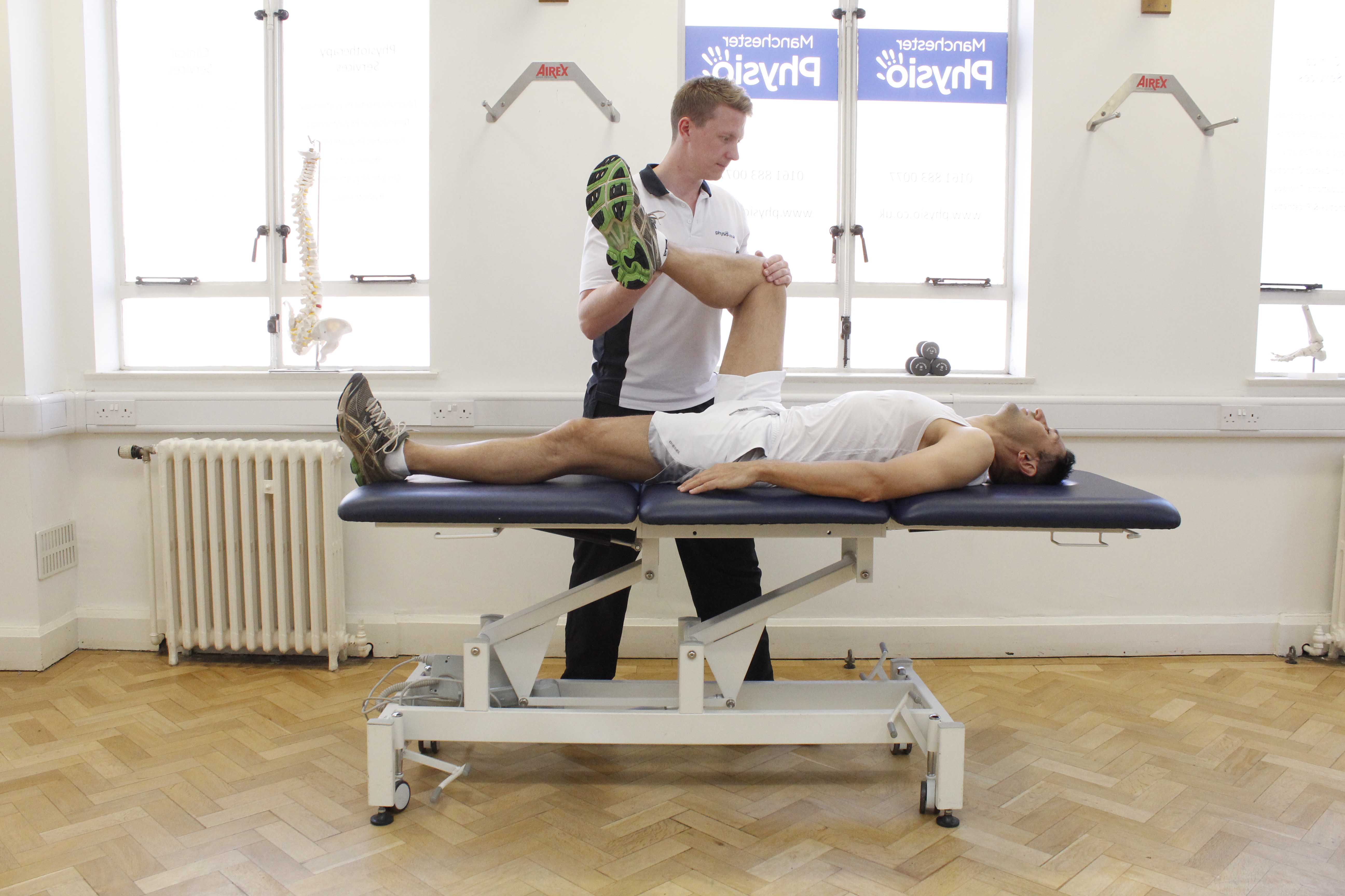 Knee stretches and joint mobilisations performed by an experienced physiotherapist Knee stretches and joint mobilisations performed by an experienced physiotherapist