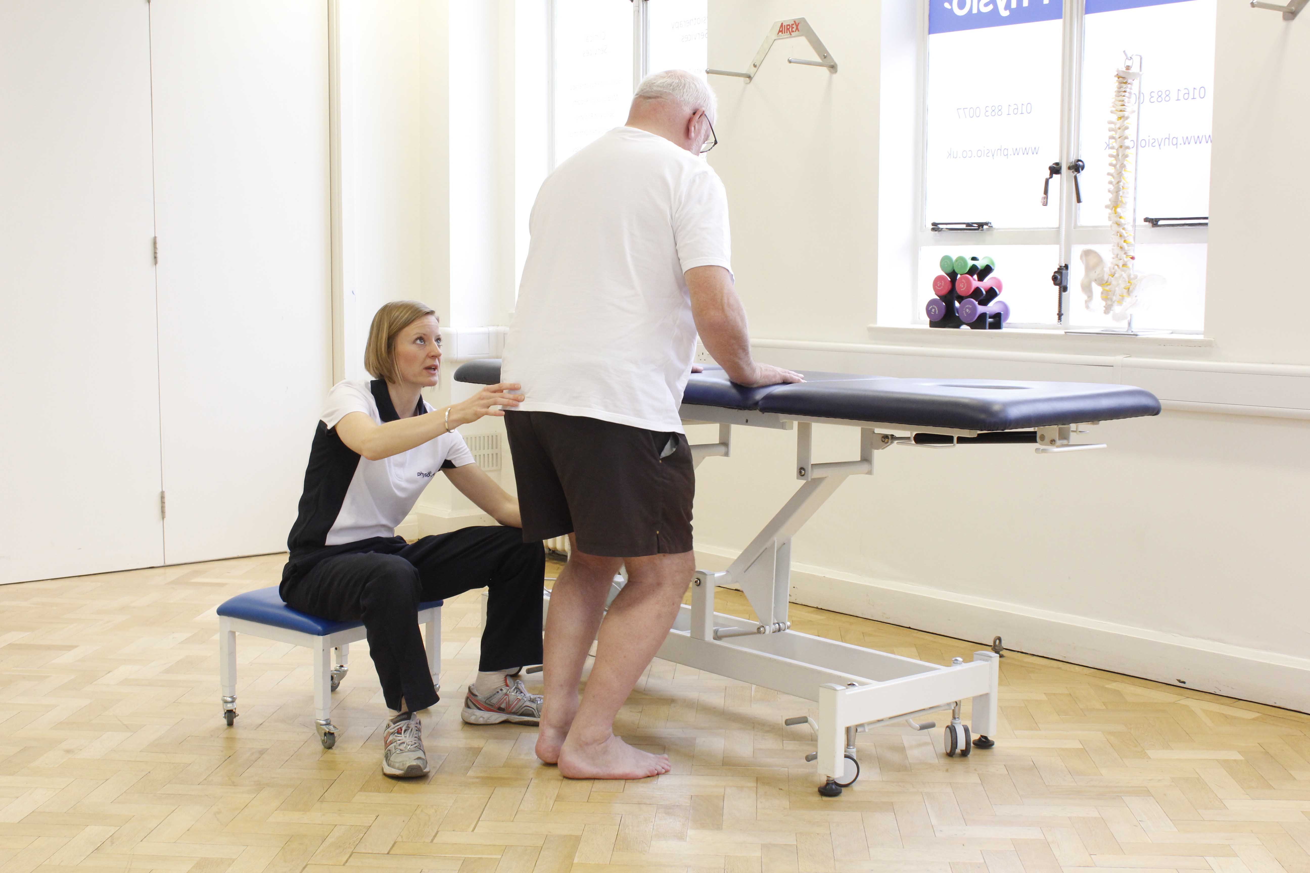 Mini squats to develop functional strength and fine motor control of the lower limbs under supervision of a neurological physiotherapist